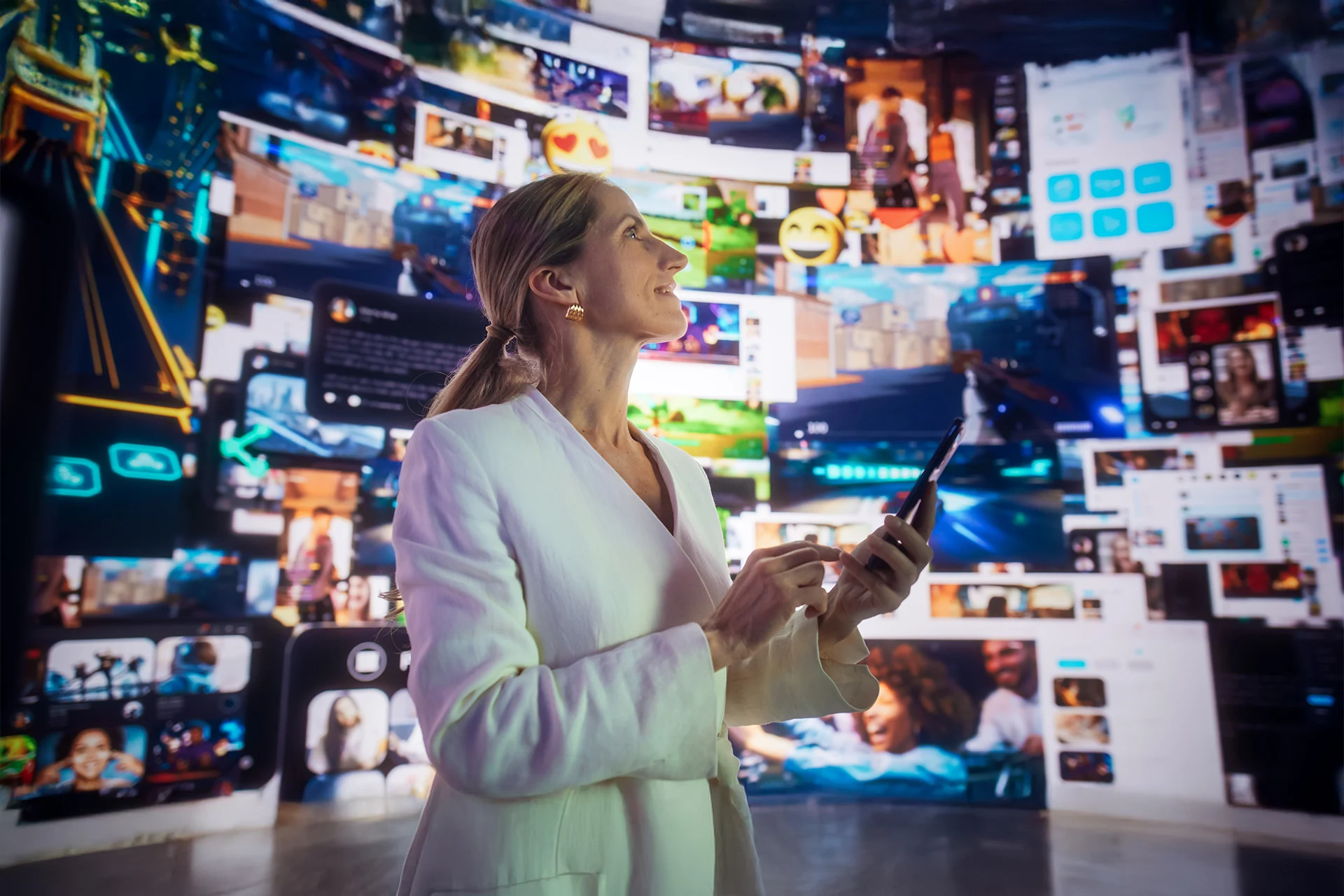 Woman interacting with a digital display showcasing technology content