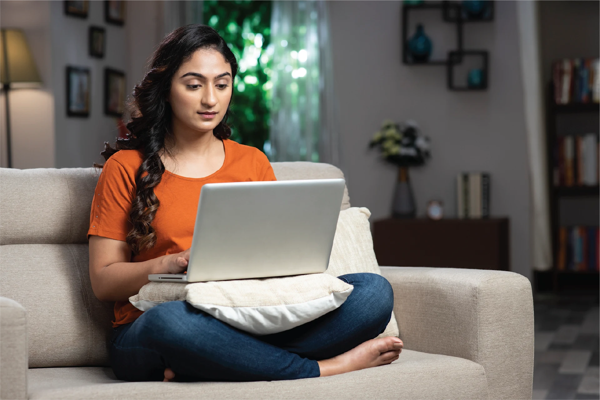 Woman working remotely on a laptop at home
