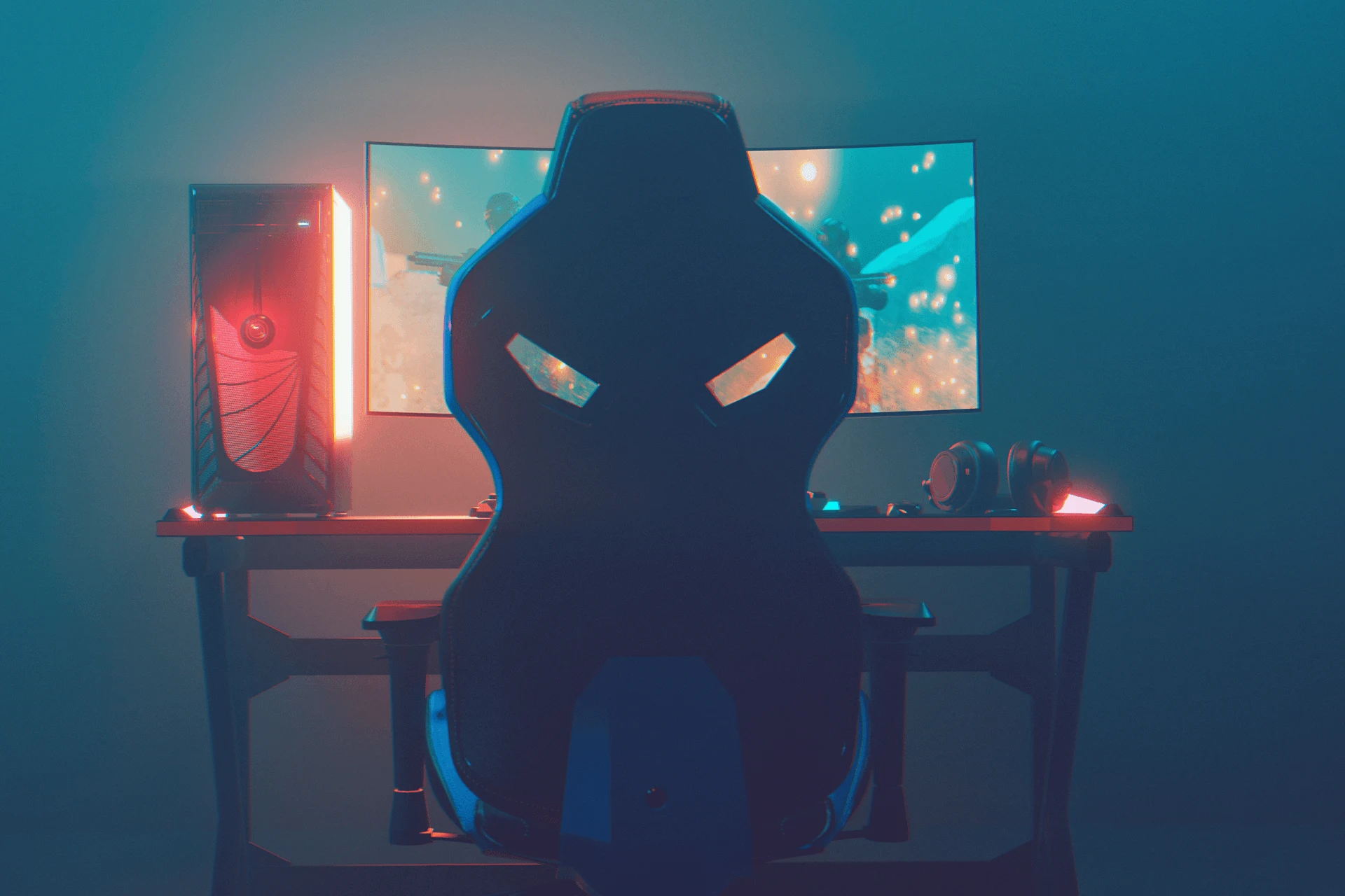 Person gaming with a controller while focused on a colorful computer screen.