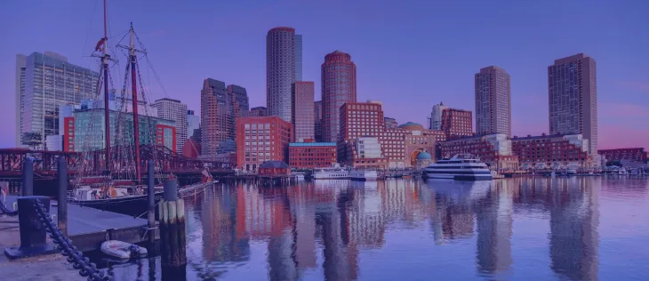 Boston waterfront skyline cityscape view reflecting on water with boats