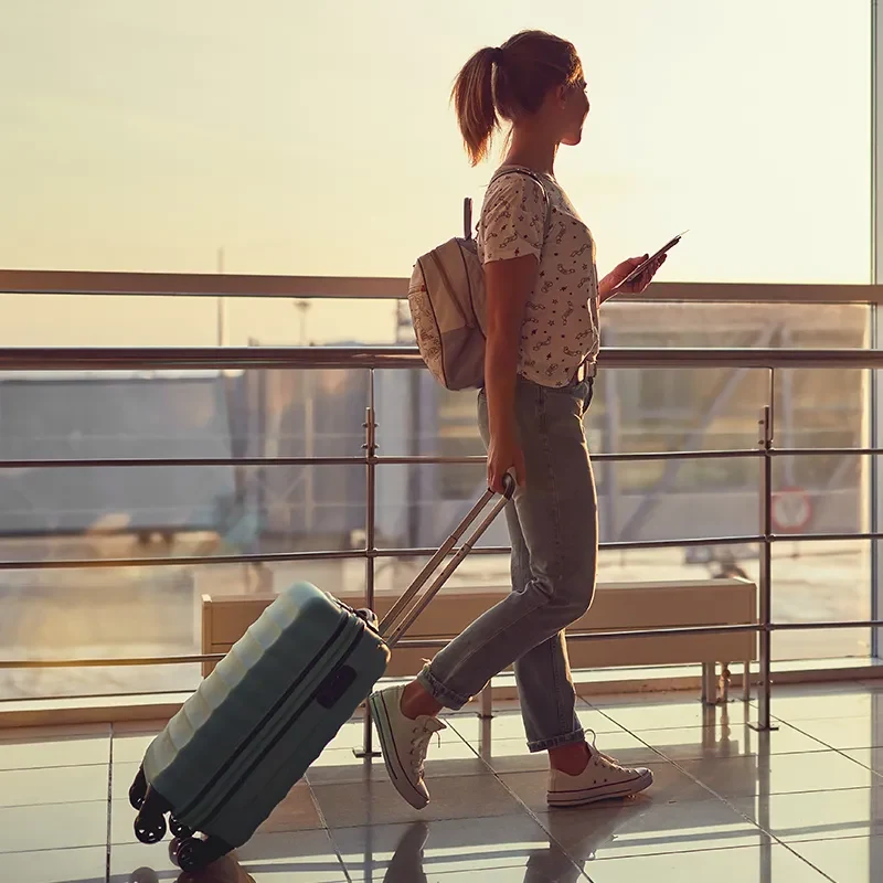 Travelers using digital services in hospitality settings showing technology‑enabled guest interactions