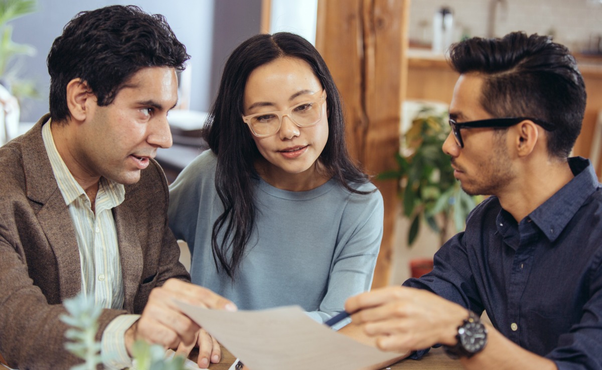 couple asking a real estate agent questions