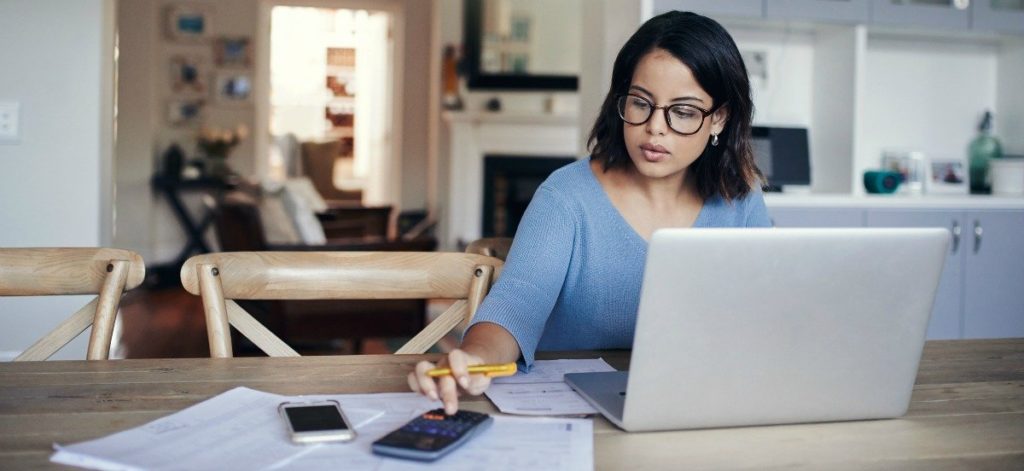 cost of buying a house woman calculating