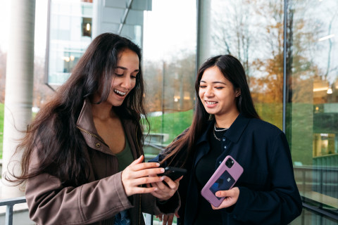 Two girls looking at phone