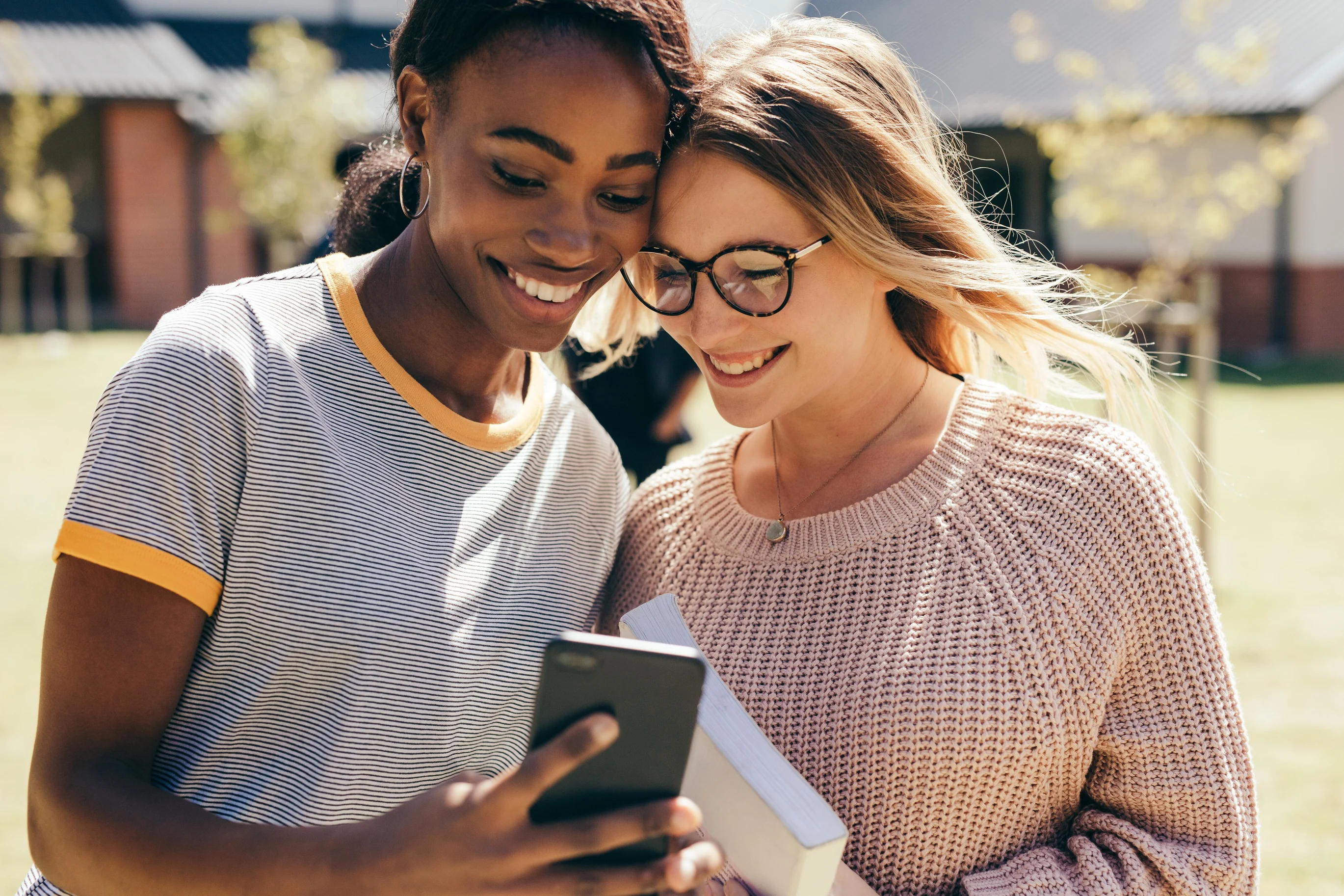 two girls looking at phone