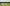 800px-Silage windrows and two tractors 2