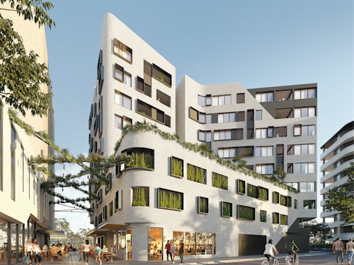 Image of apartment building exterior with lots of trees and outdoor seating