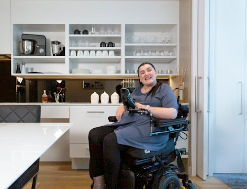 person in an accessible kitchen in an SDA home