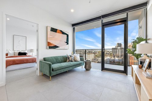 an accessible apartment, living room, balcony and bedroom pictured.