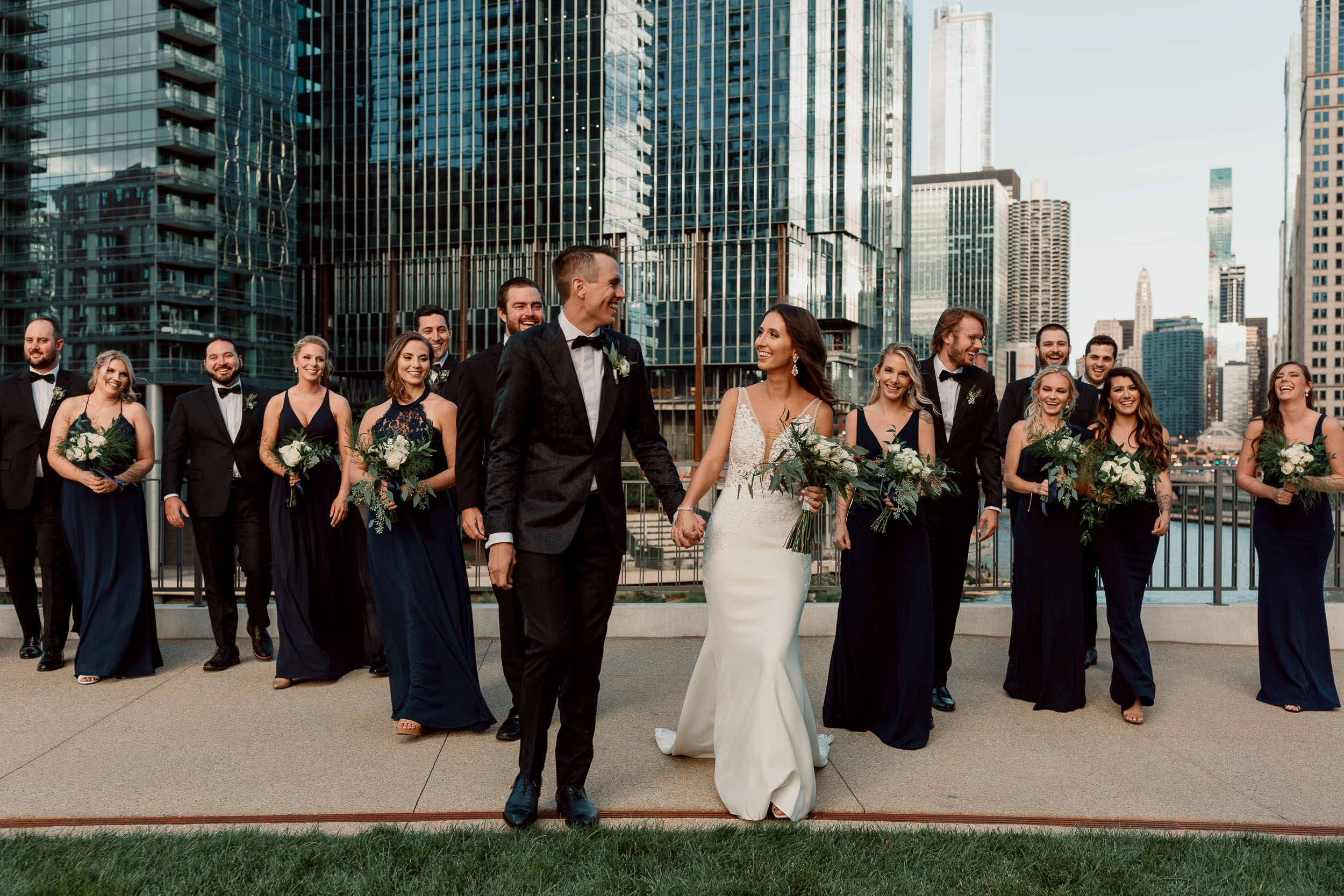 Bridal party for downtown Chicago wedding on the river with skyline