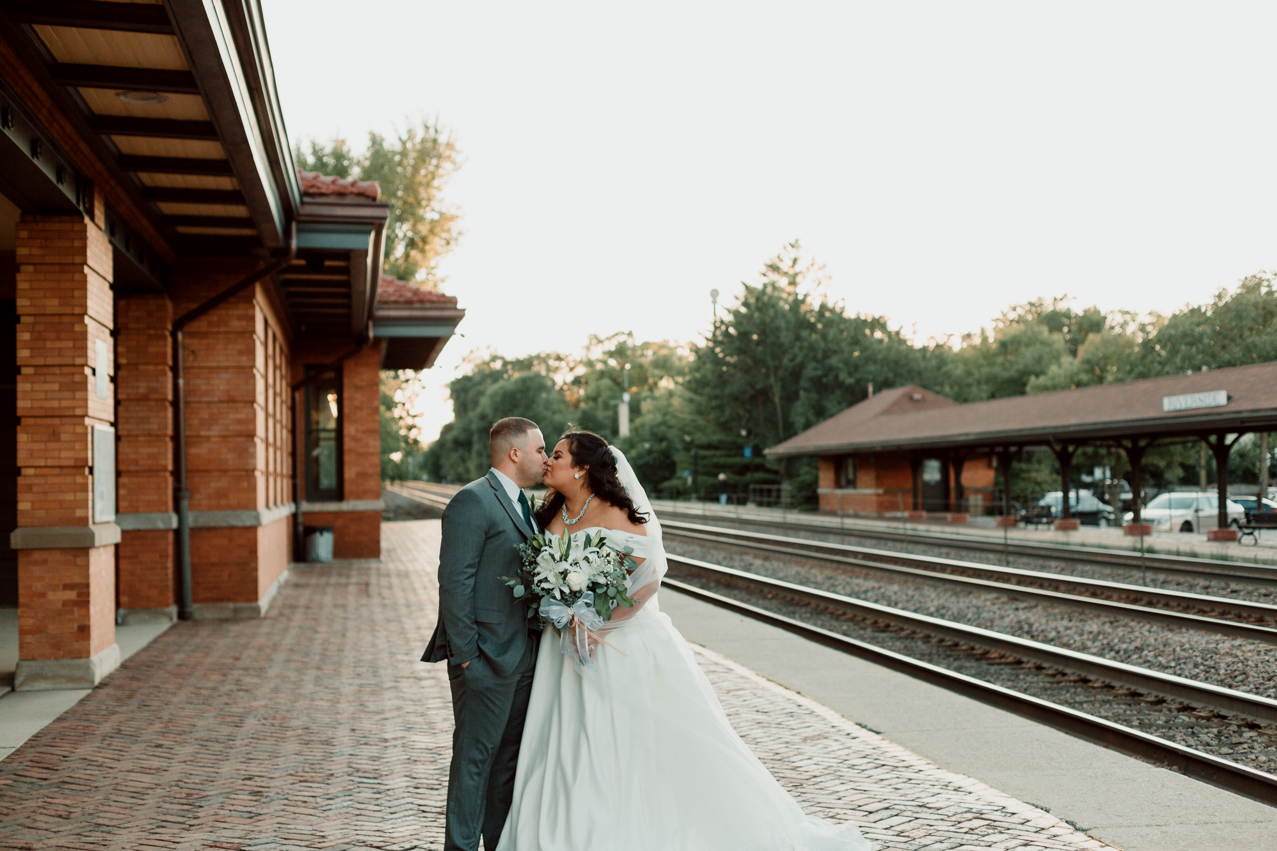 Sunset wedding photos by train station | Backyard Chicago Wedding | Emotional Chicago Wedding | Historic Downtown Riverside Wedding Photos | Chicago Wedding Photographer | Metra Station Wedding Photos | Small Weddings in Chicago | Intimate Elopements in Chicago