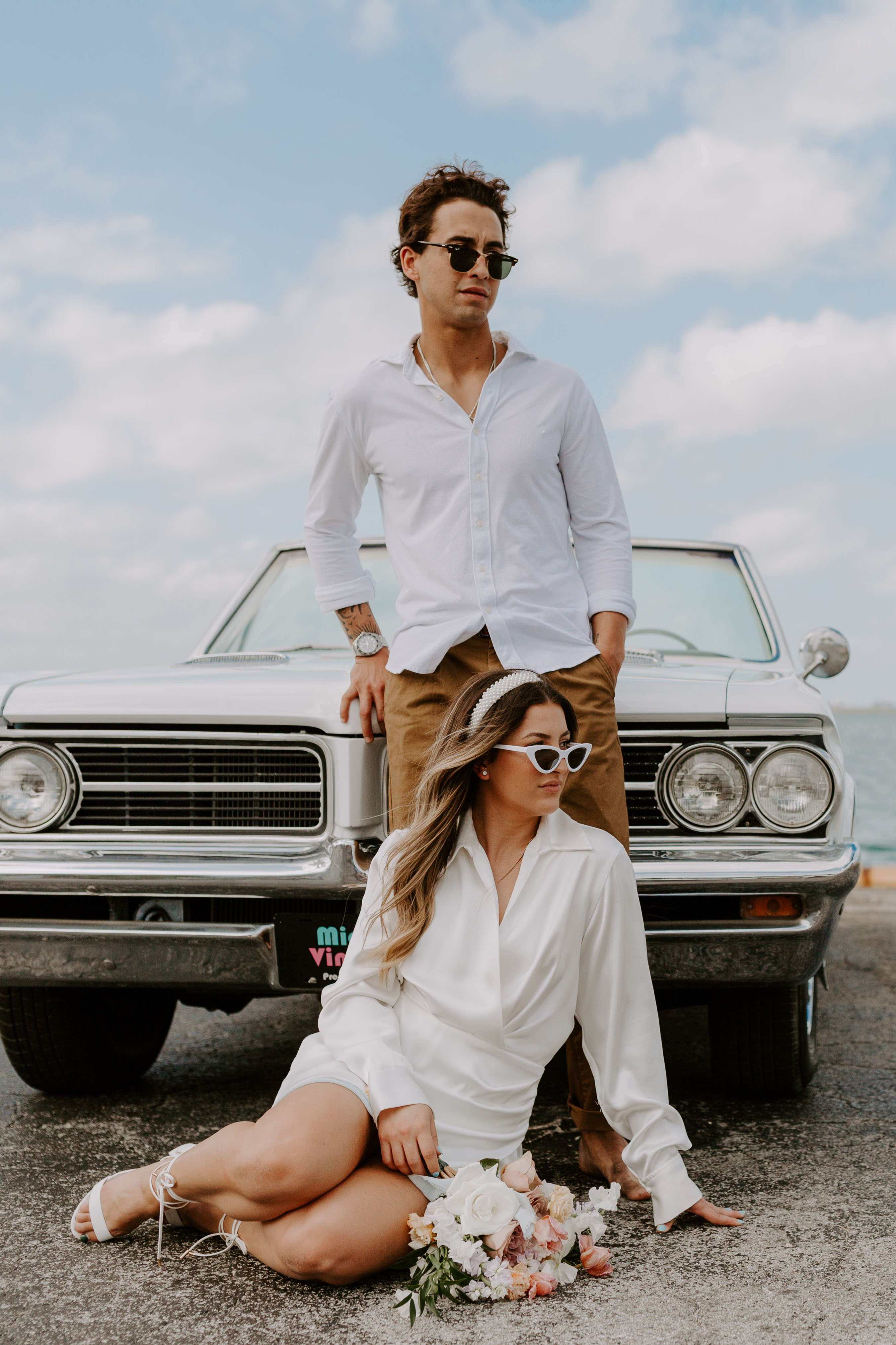 Stylish bride and groom elopement with car