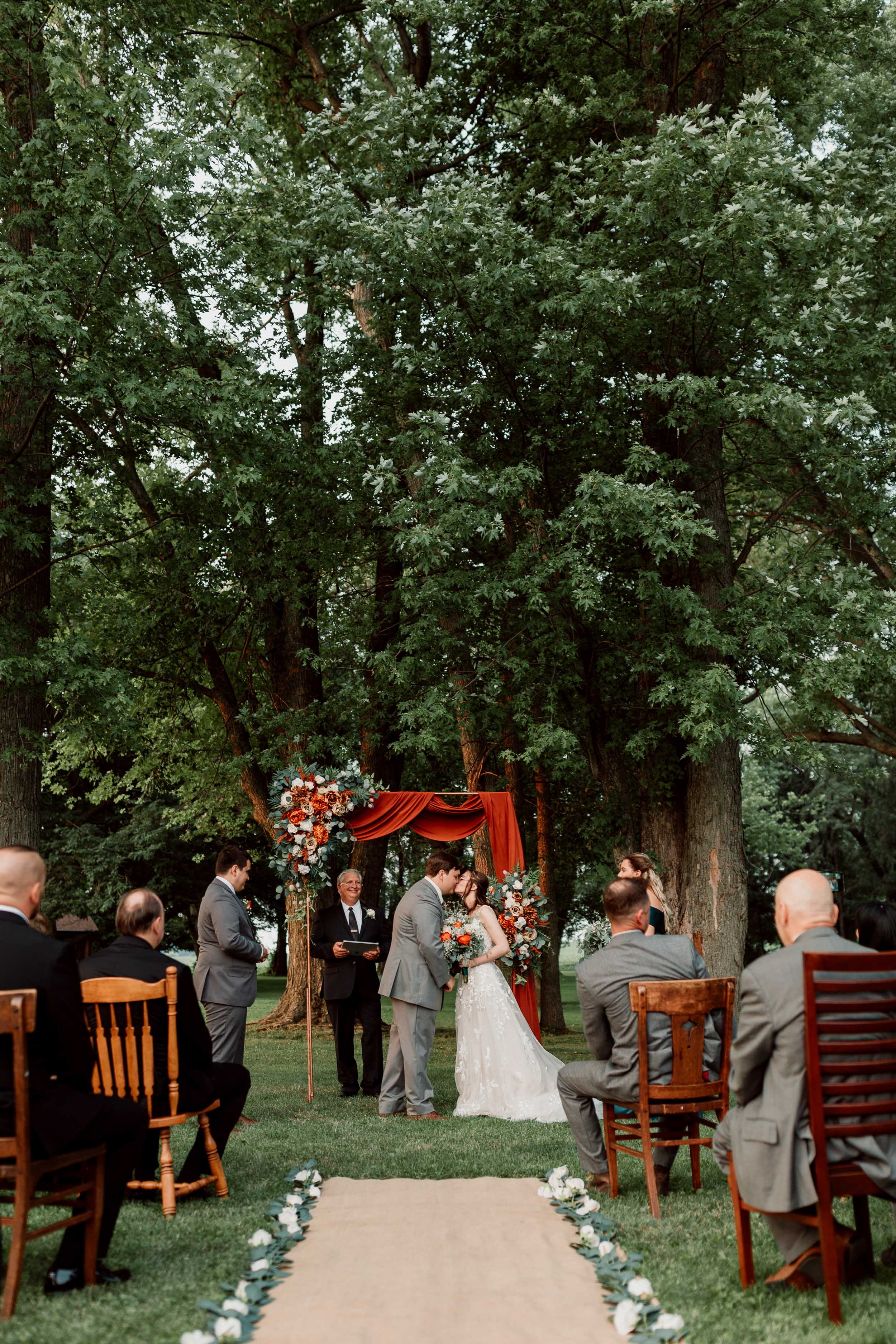 wedding ceremony aisle decorated with flowers | Pecatonica Illinois Backyard Micro Wedding | Central Illinois Micro Weddings
