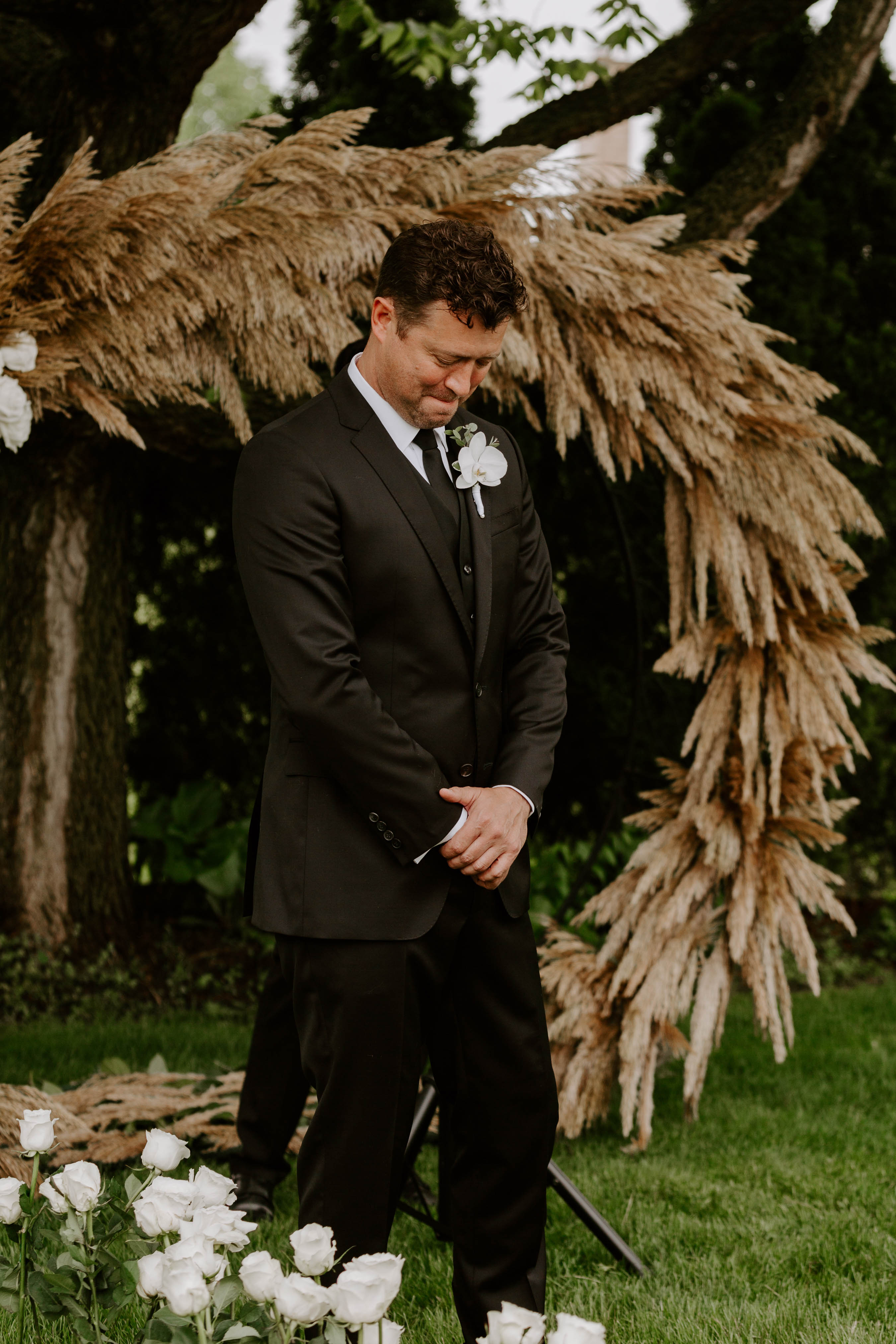 Groom seeing bride as she is walking down the aisle for the first time