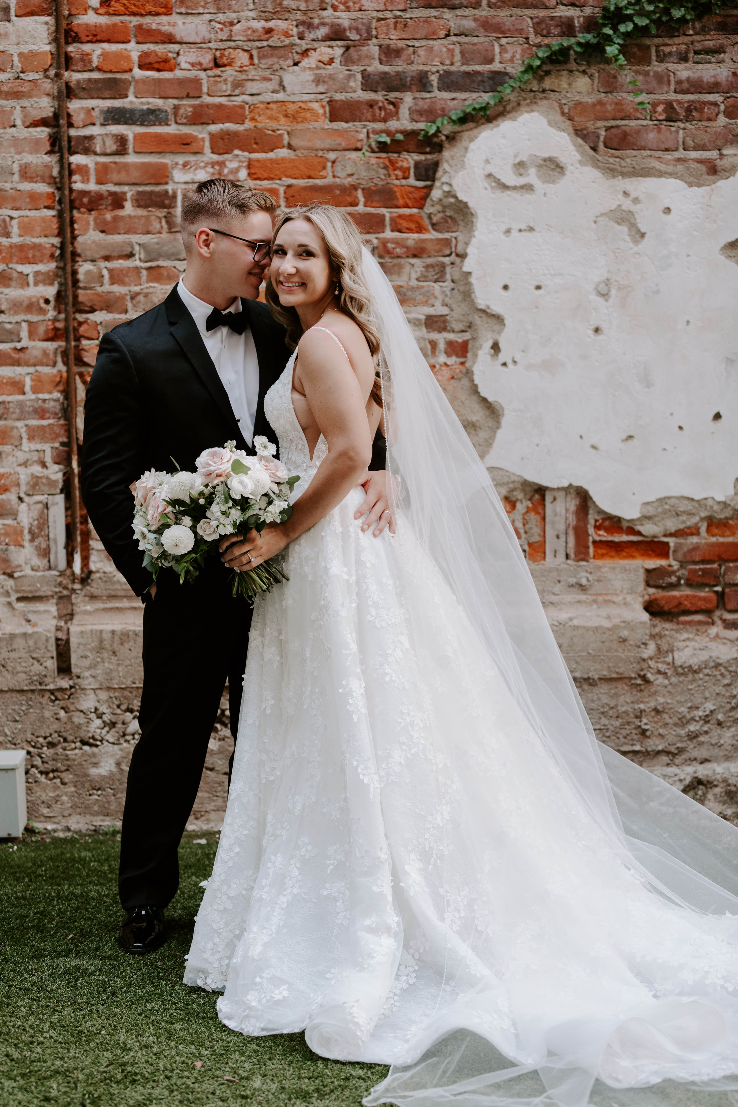 Best locations for outdoor wedding photos with brick wall as backdrop at Hotel Covington