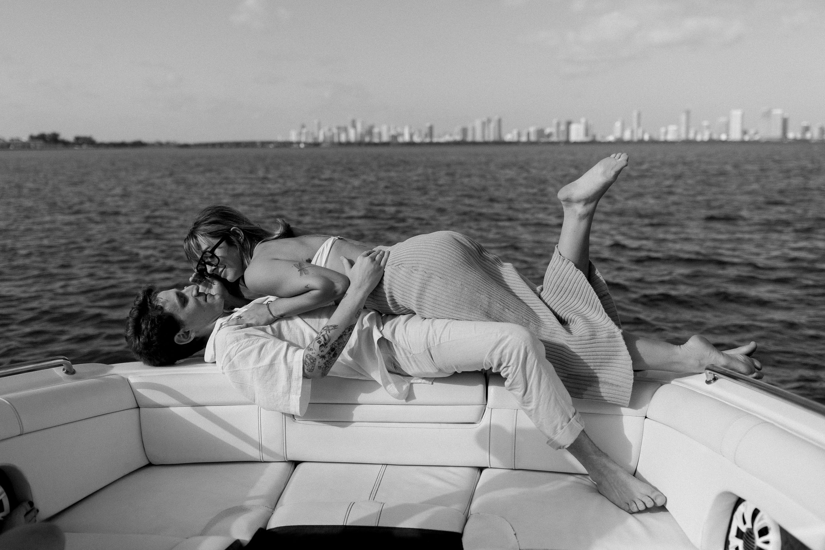 Lovers on a boat with Miami in the background