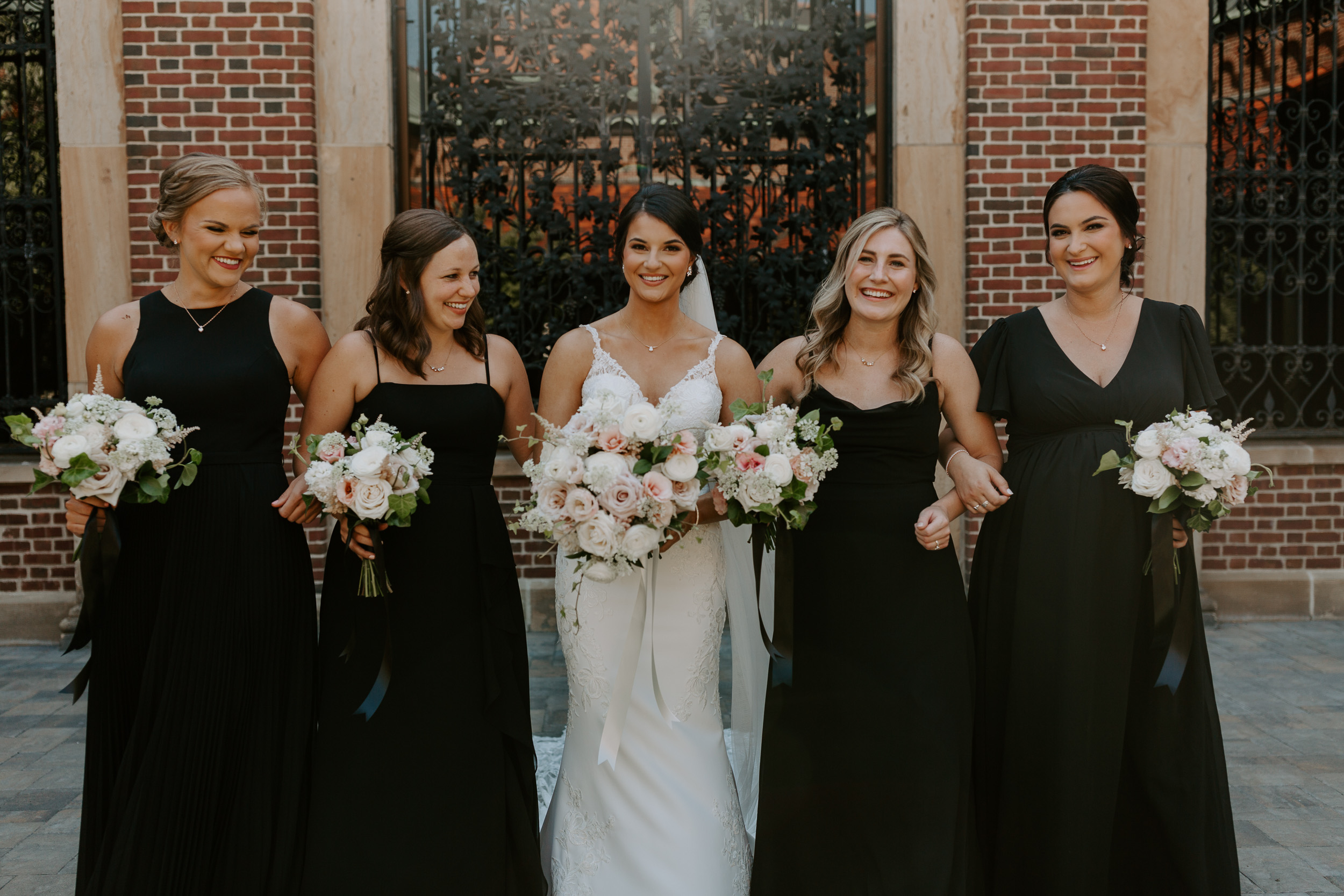 Bride with bridesmaids at Dayton Art Institute Wedding | Bridal party photos with black bridesmaids dresses