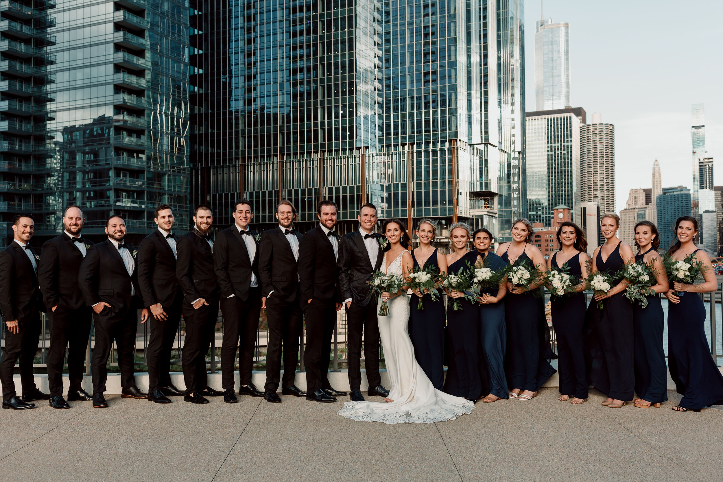 Bridal party for downtown Chicago wedding on the river with skyline
