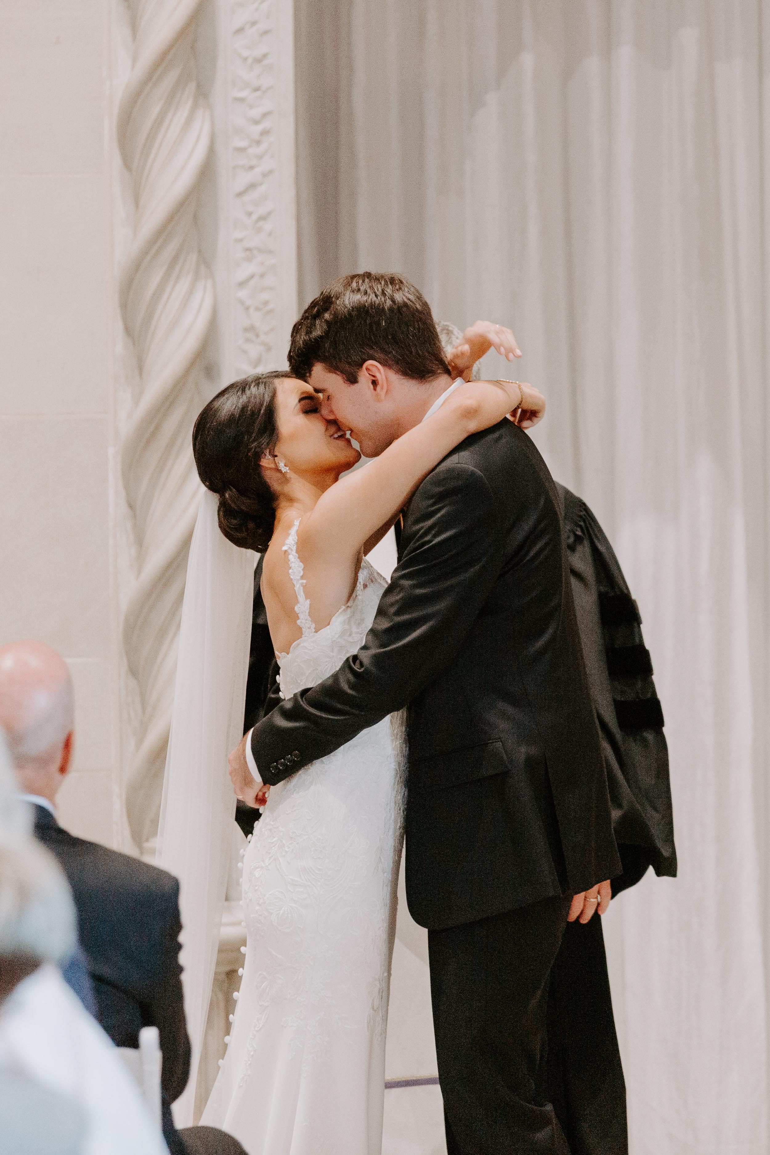 Bride and groom kissing after wedding ceremony at Dayton Art Institute Wedding
