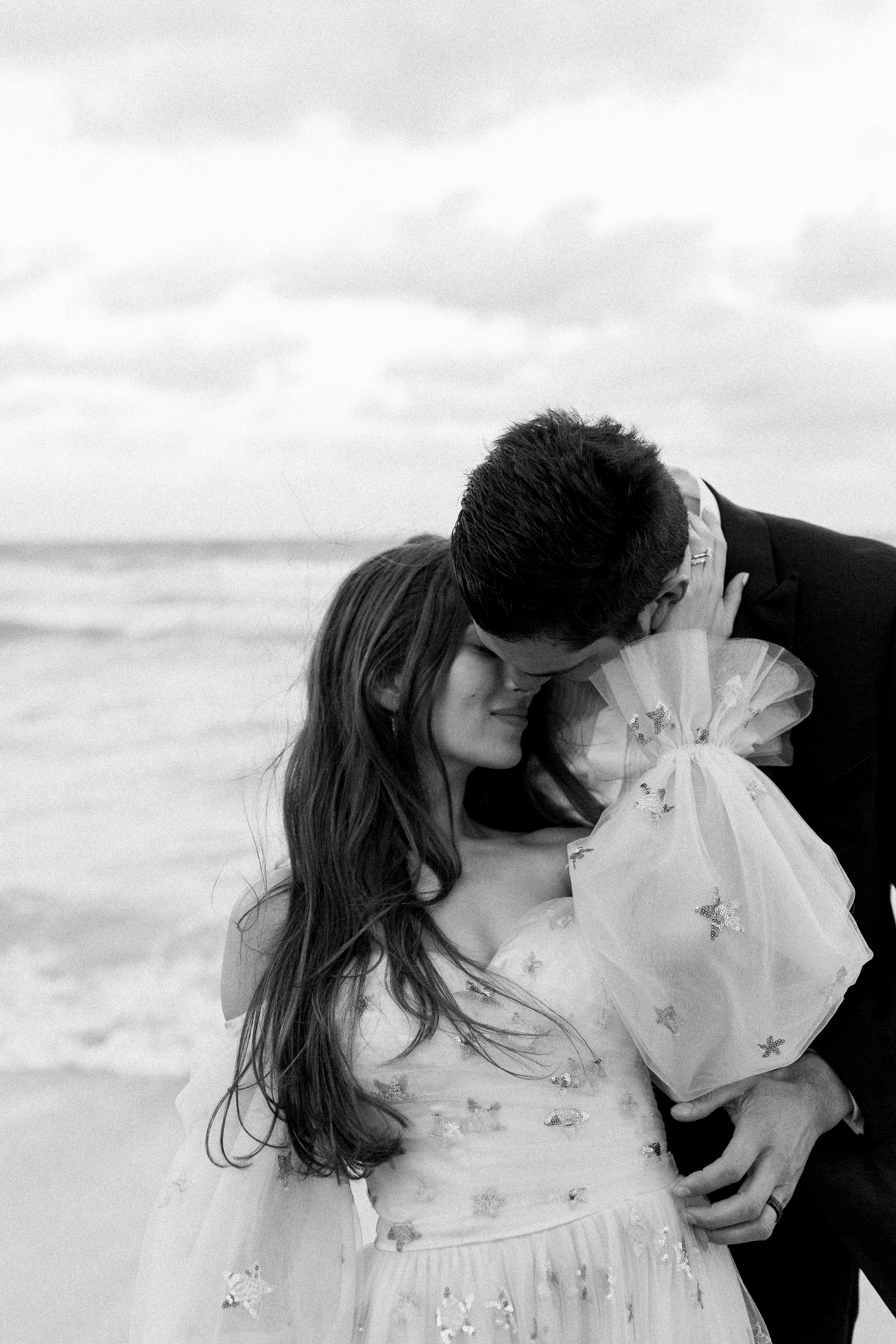 Black and white photos of couple at the beach
