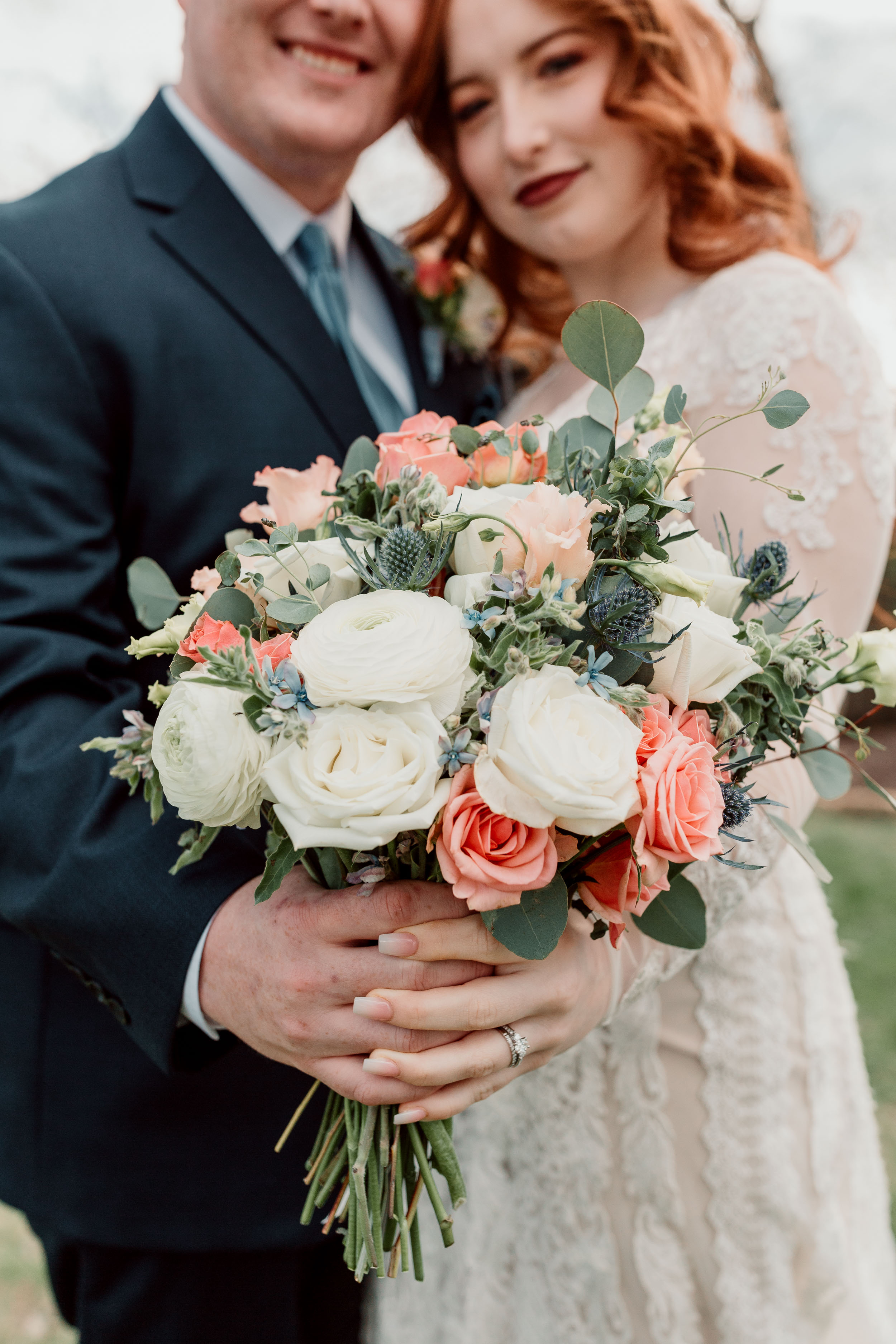 Bridal bouquet with white and orange flowers and eucalyptus | Galena Illinois Airbnb Wedding | Wedding Photographer | Eagle Ridge Galena Wedding | Outdoor Wedding Inspiration | Small Intimate Elopement Wedding