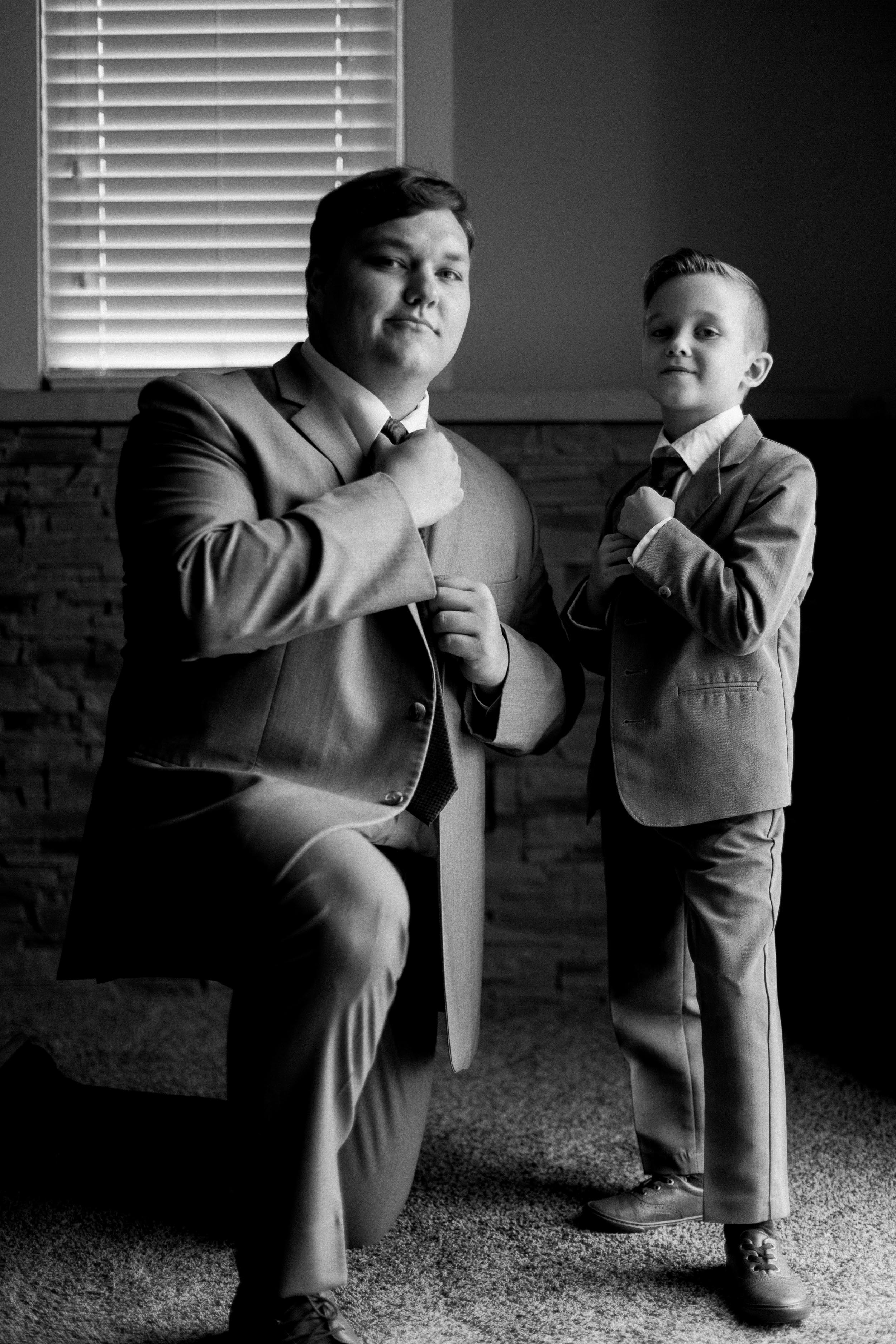 groom getting ready for wedding day | black and white wedding photos | Rockford Illinois Wedding Photographer
