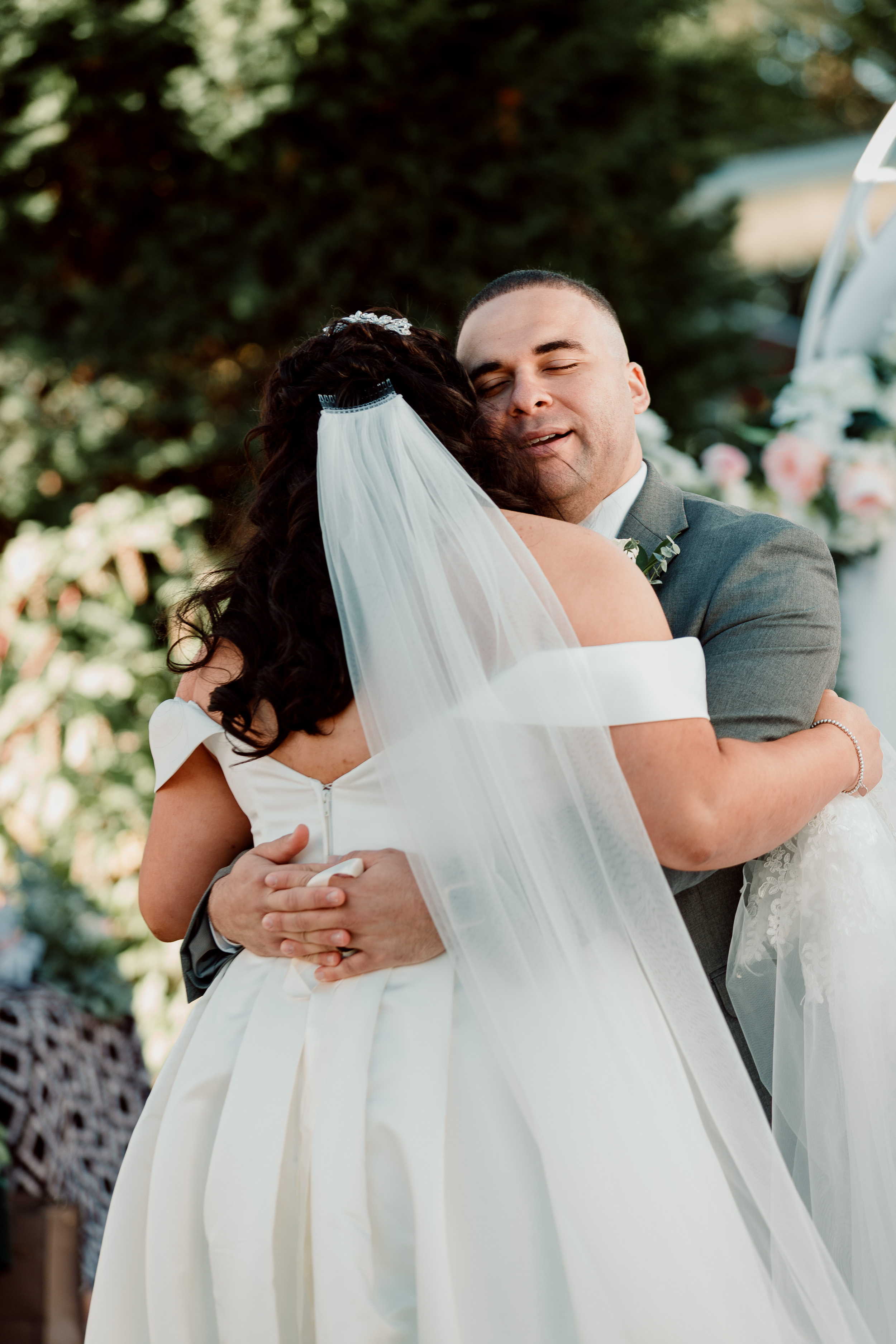 Sweet moments between bride and groom at Backyard Chicago Wedding | Emotional Chicago Wedding | Historic Downtown Riverside Wedding Photos | Chicago Wedding Photographer | Metra Station Wedding Photos | Small Weddings in Chicago | Intimate Elopements in Chicago