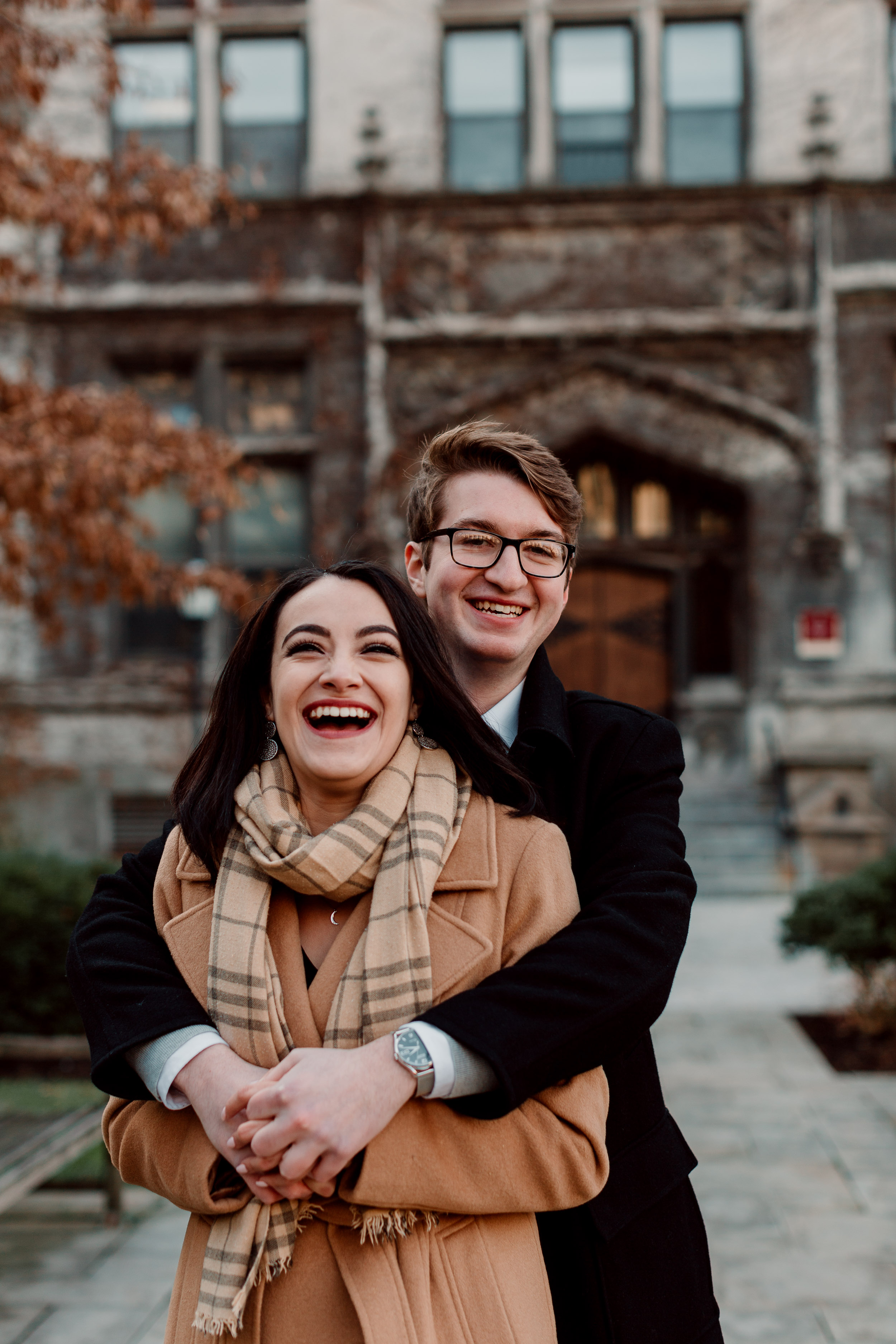 Candid poses for engagement photo sessions | University of Chicago campus engagement session | Chicago engagement photographer | Chicago engagement photo locations | Winter engagement in Chicago | Where to take Chicago engagement photos | Chicago skyline engagement