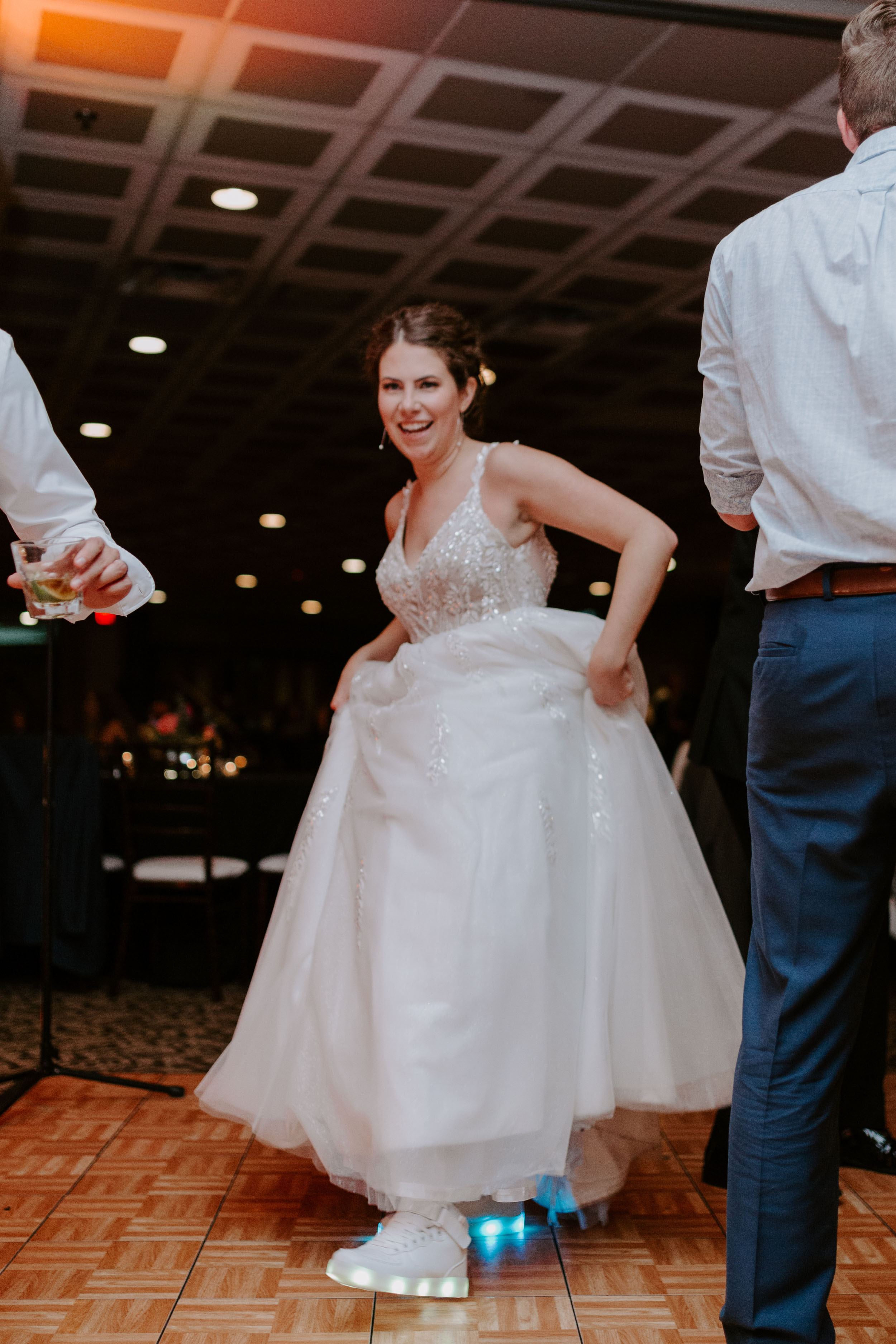 Bride dancing with light up shoes at Brewery Reception at Two Brothers Round House in Aurora, Illinois