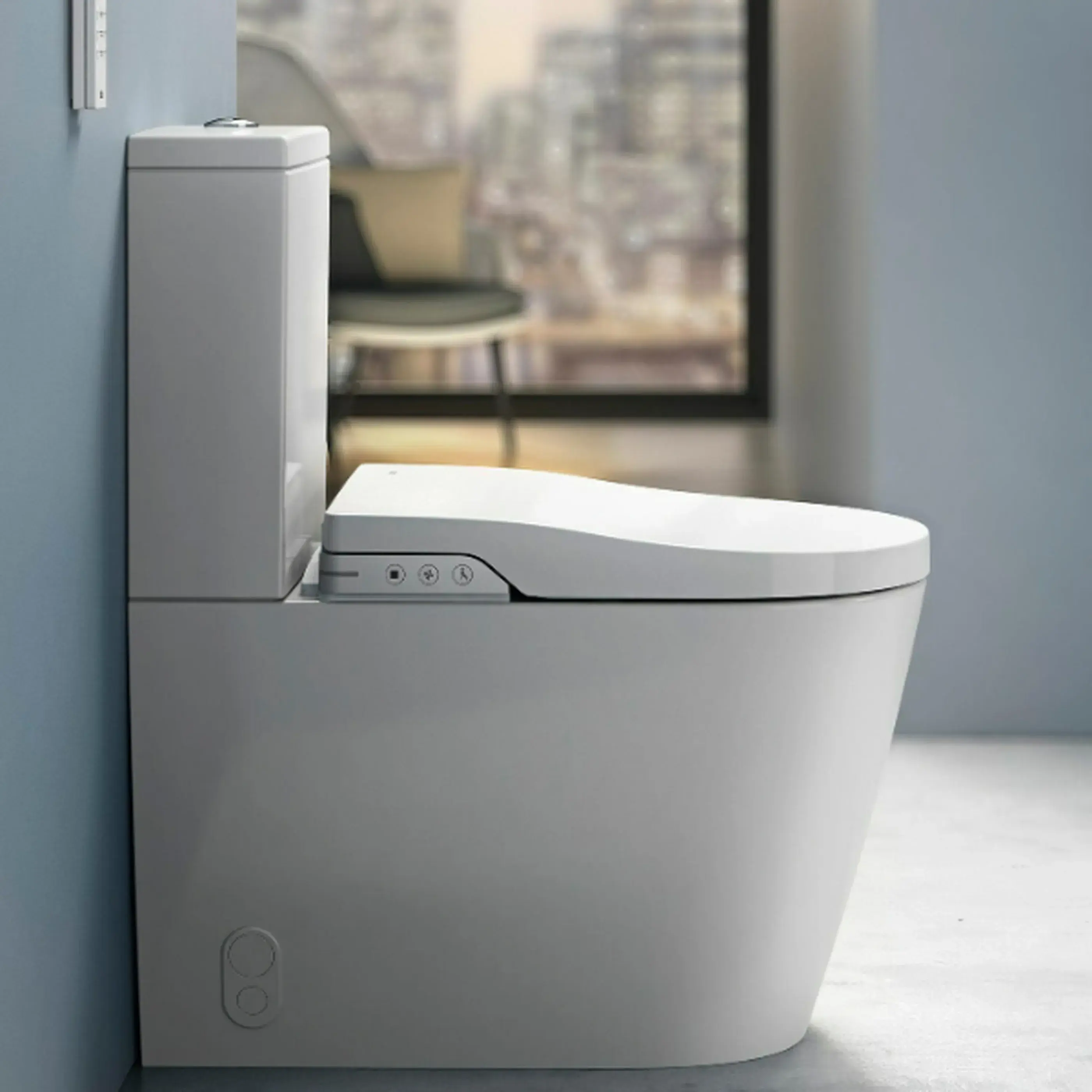 Modern white toilet with electronic bidet seat featuring control buttons, installed in a light blue bathroom.