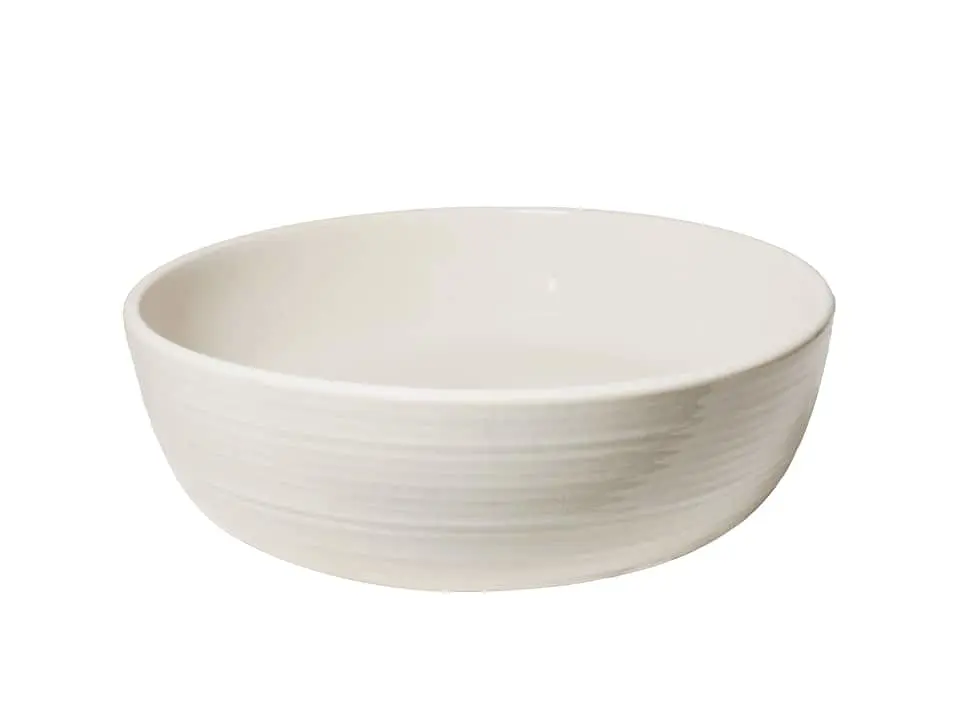 Robert Gordon above counter basin in white glaze finish.