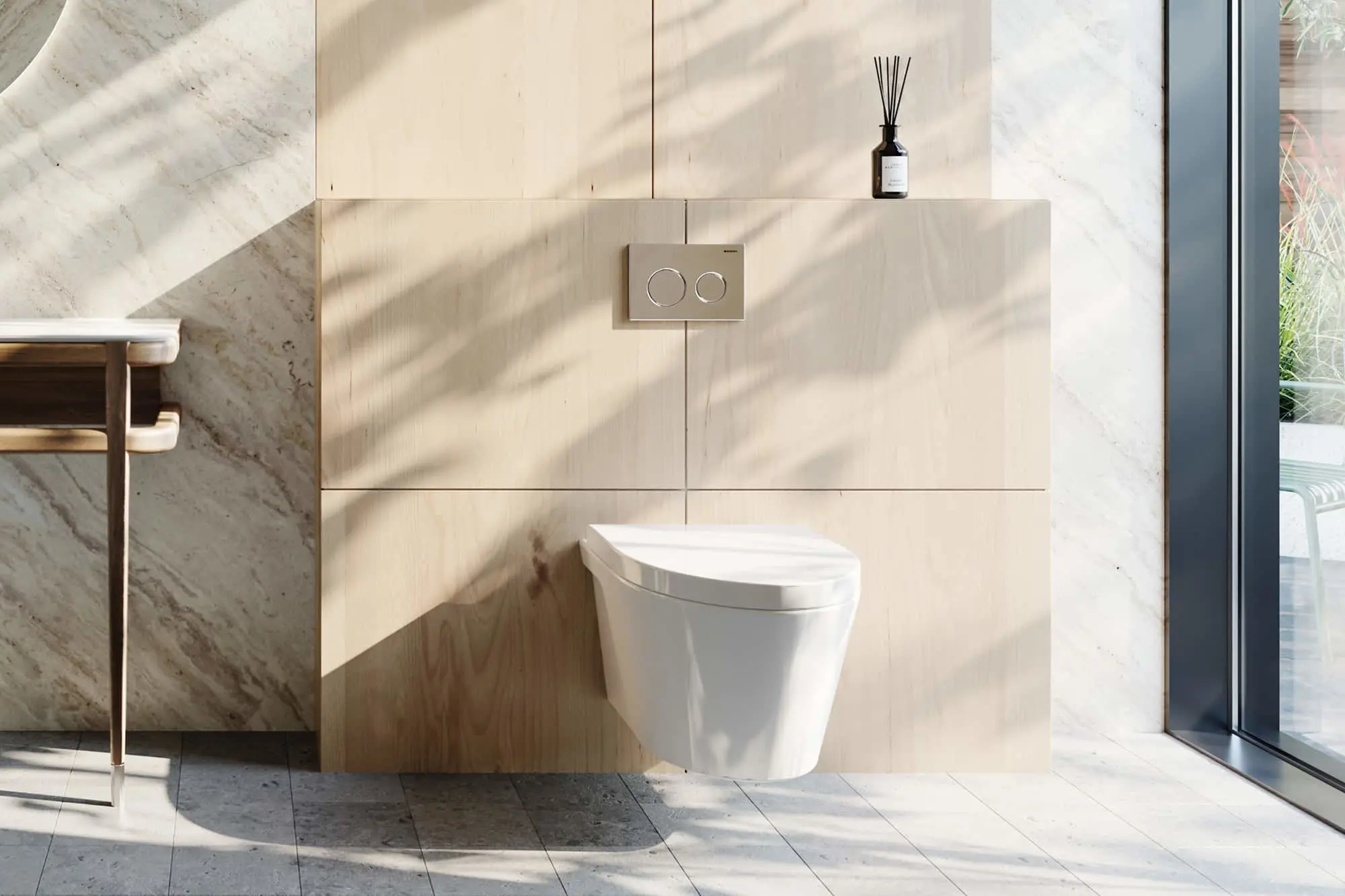 Modern bathroom with wall-mounted white toilet, light wood paneling, marble accents, and reed diffuser on shelf.