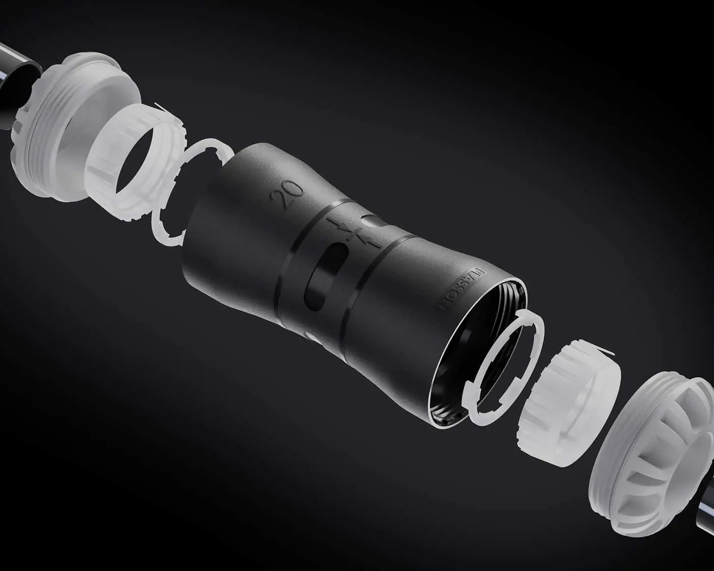 Exploded view of a black coupler fitting, showing internal parts against dark background.