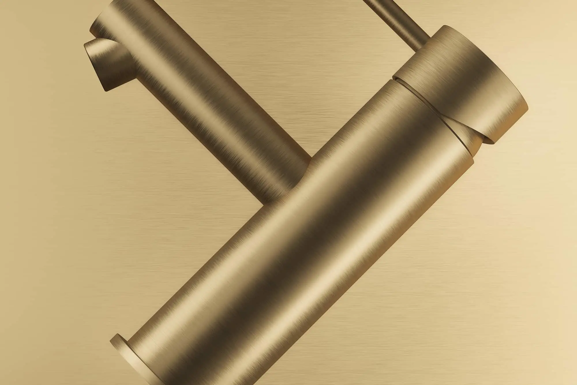 Modern brushed gold kitchen faucet with minimalist design against a gold background.