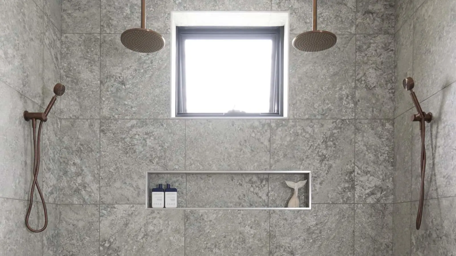 Modern shower with gray marble tiles, dual rainfall showerheads, handheld sprayers, built-in shelf, and small window.