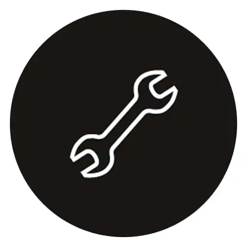 White outline of a wrench icon on a black circular background