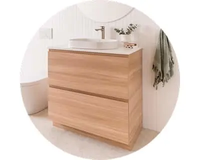 Modern wooden bathroom vanity with two drawers, white vessel sink, and minimalist design in a bright bathroom.
