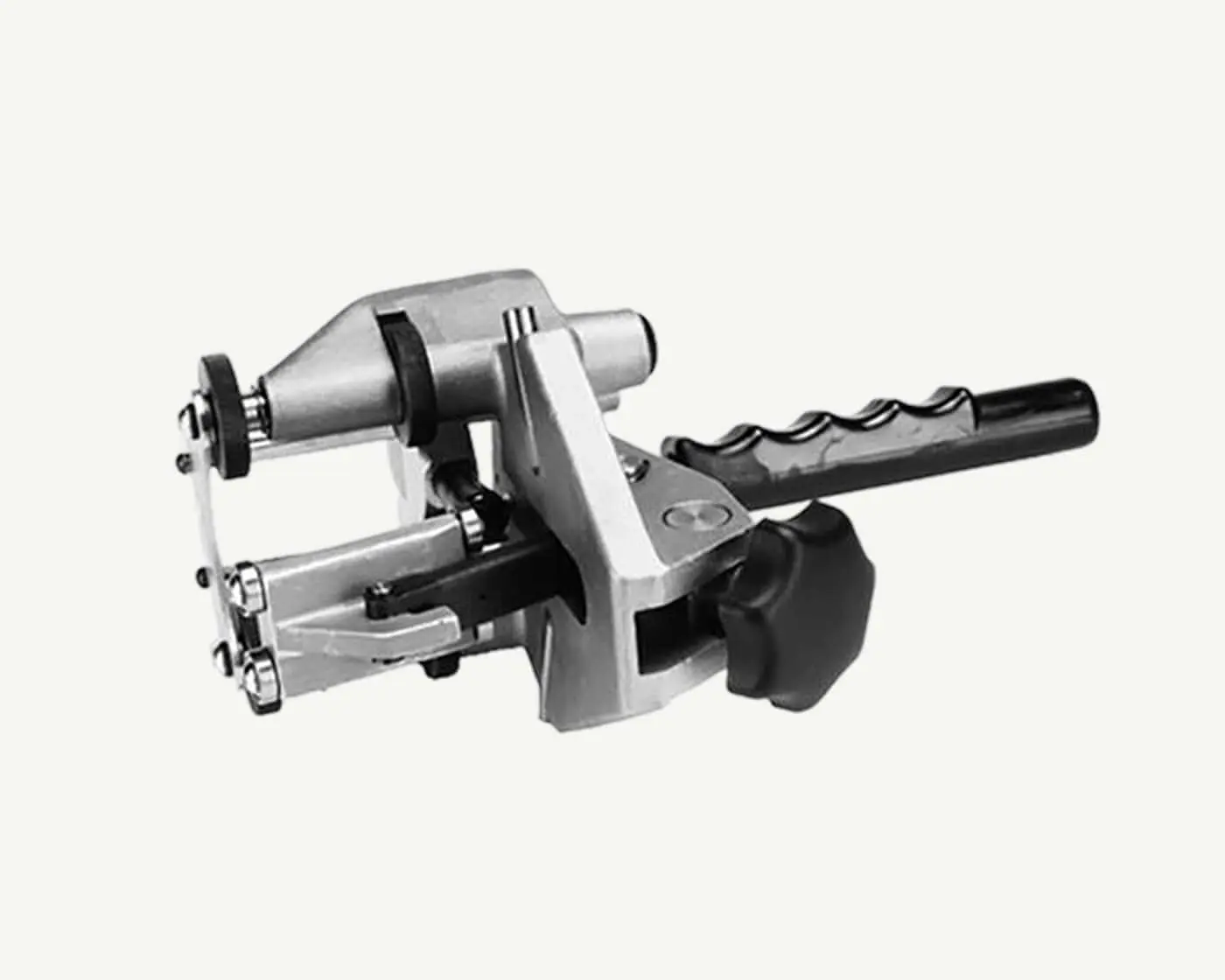 Metal pipe cutting tool with black handle and silver mechanical components shown in black and white.