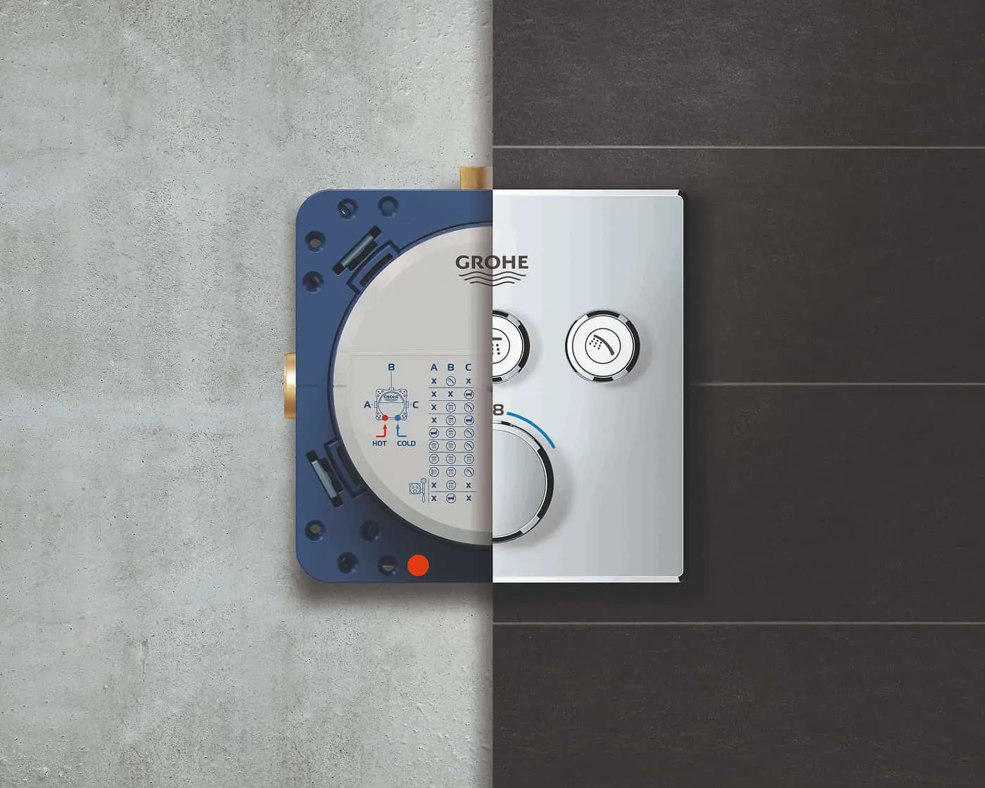 GROHE shower control panel showing internal mechanism and finished exterior mounted on contrasting light and dark wall tiles.