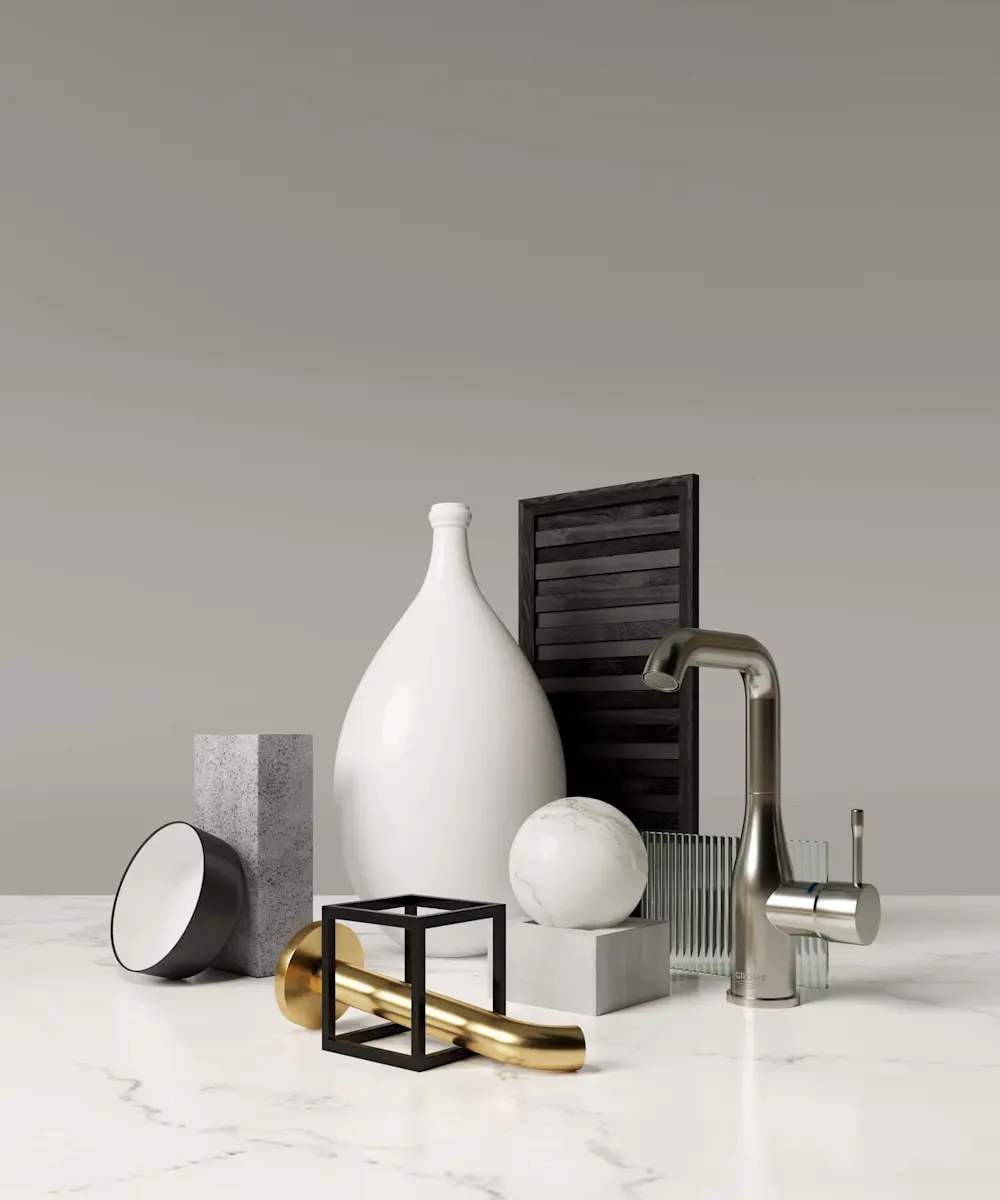 Modern interior design elements including a white vase, marble sphere, stainless steel faucet, and decorative objects on marble surface.