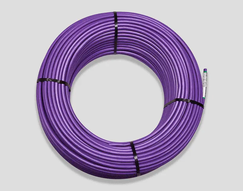 Coiled purple cable or wire secured with black ties, formed in a circular shape against a light gray background.