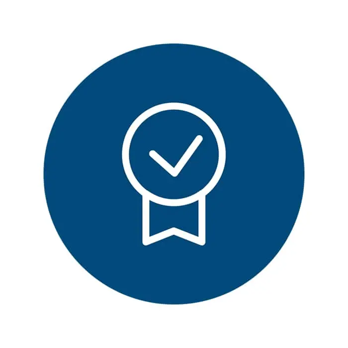 Blue circular icon with white checkmark inside a circle with ribbon, representing achievement or certification.