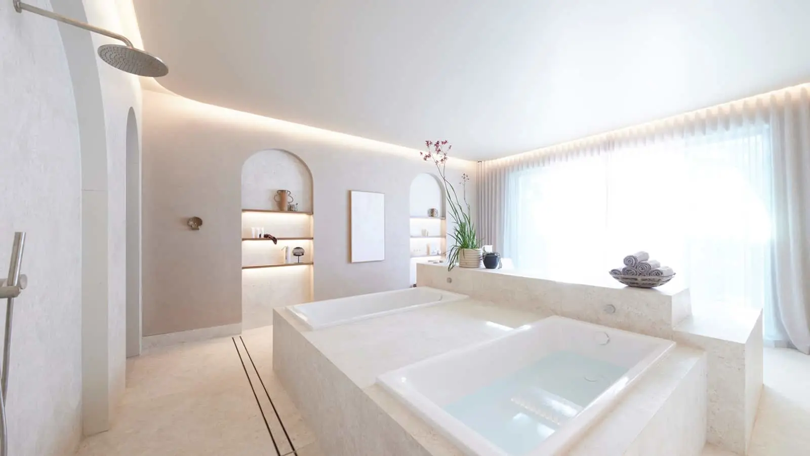 Modern white bathroom with built-in bathtub, rainfall shower, recessed lighting, and minimalist decor.