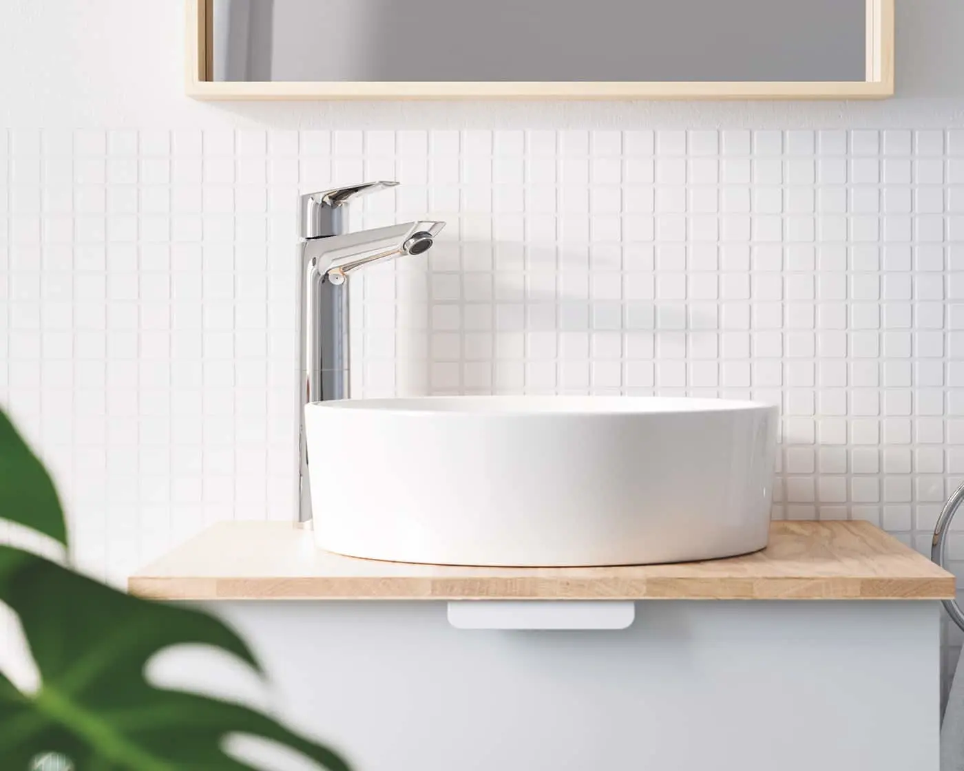Modern bathroom with white vessel sink on wooden countertop, chrome faucet, and white tile backsplash.