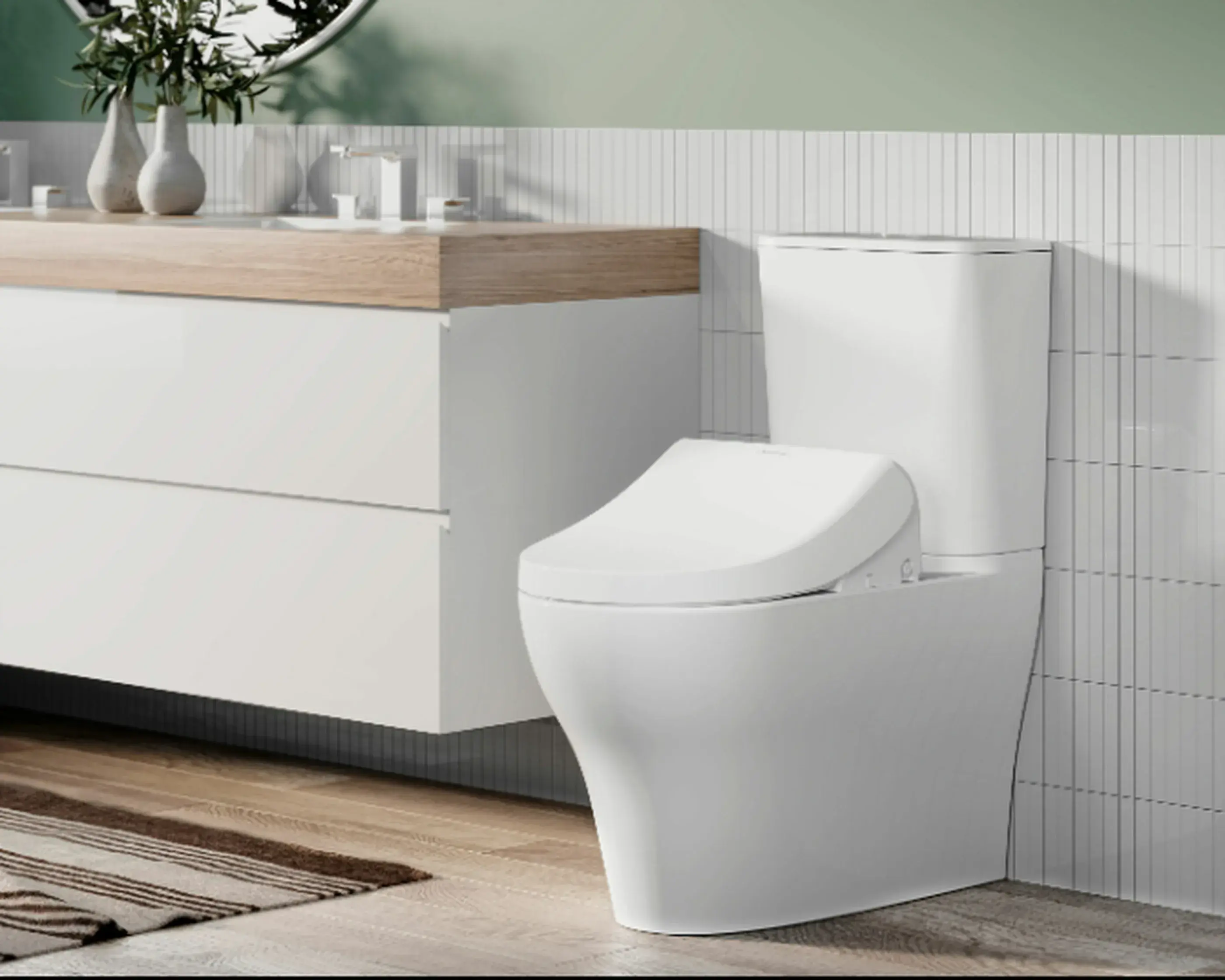 Modern white toilet next to a wooden-topped vanity with white cabinets in a bathroom with vertical tile walls.