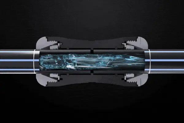 Cross-section of a pipe connector showing blue liquid flowing through transparent tubing against a black background.