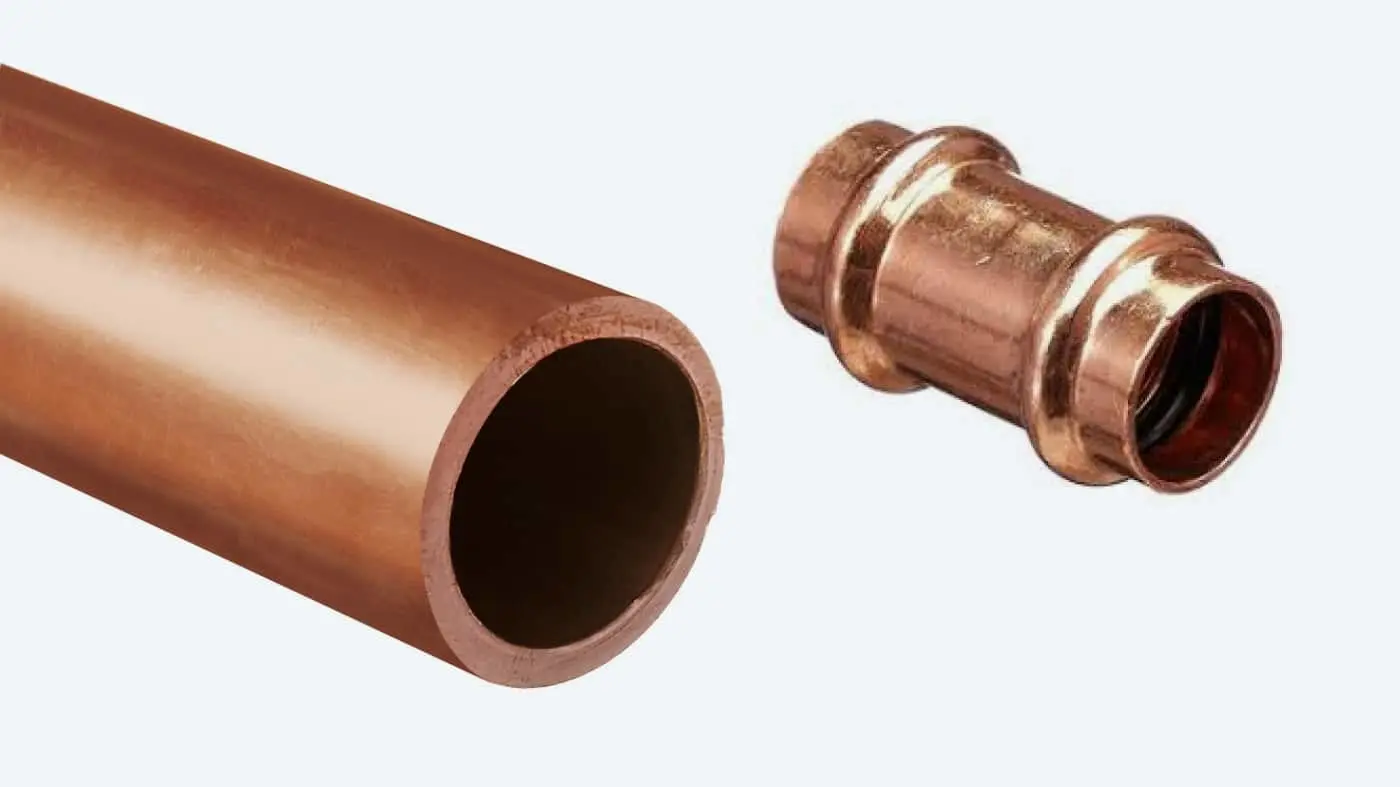 Copper plumbing pipe and fitting on white background, showing straight pipe section and connector joint.