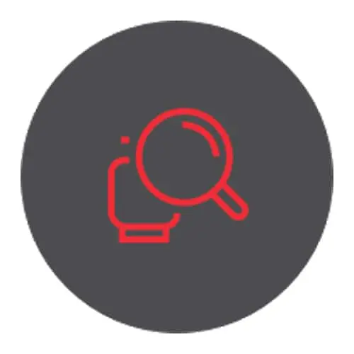 Red search icon with magnifying glass and computer symbol on dark gray circular background.