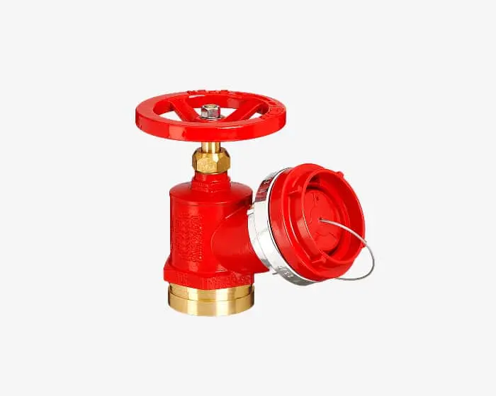 Red fire hydrant valve with brass fittings and circular handle against white background