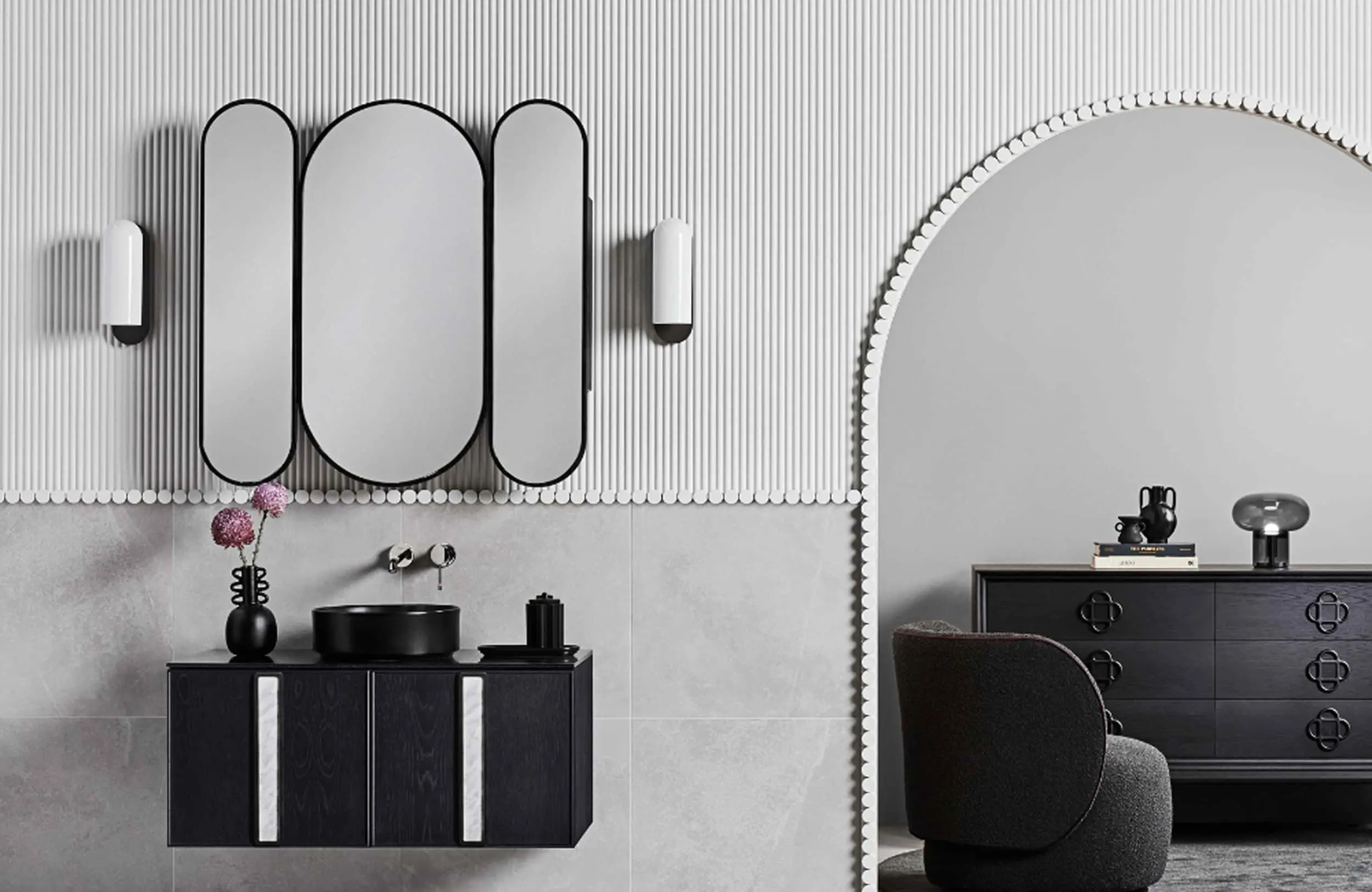 Modern bathroom with black vanity, triple mirror, textured white walls, and arched doorway leading to bedroom area.